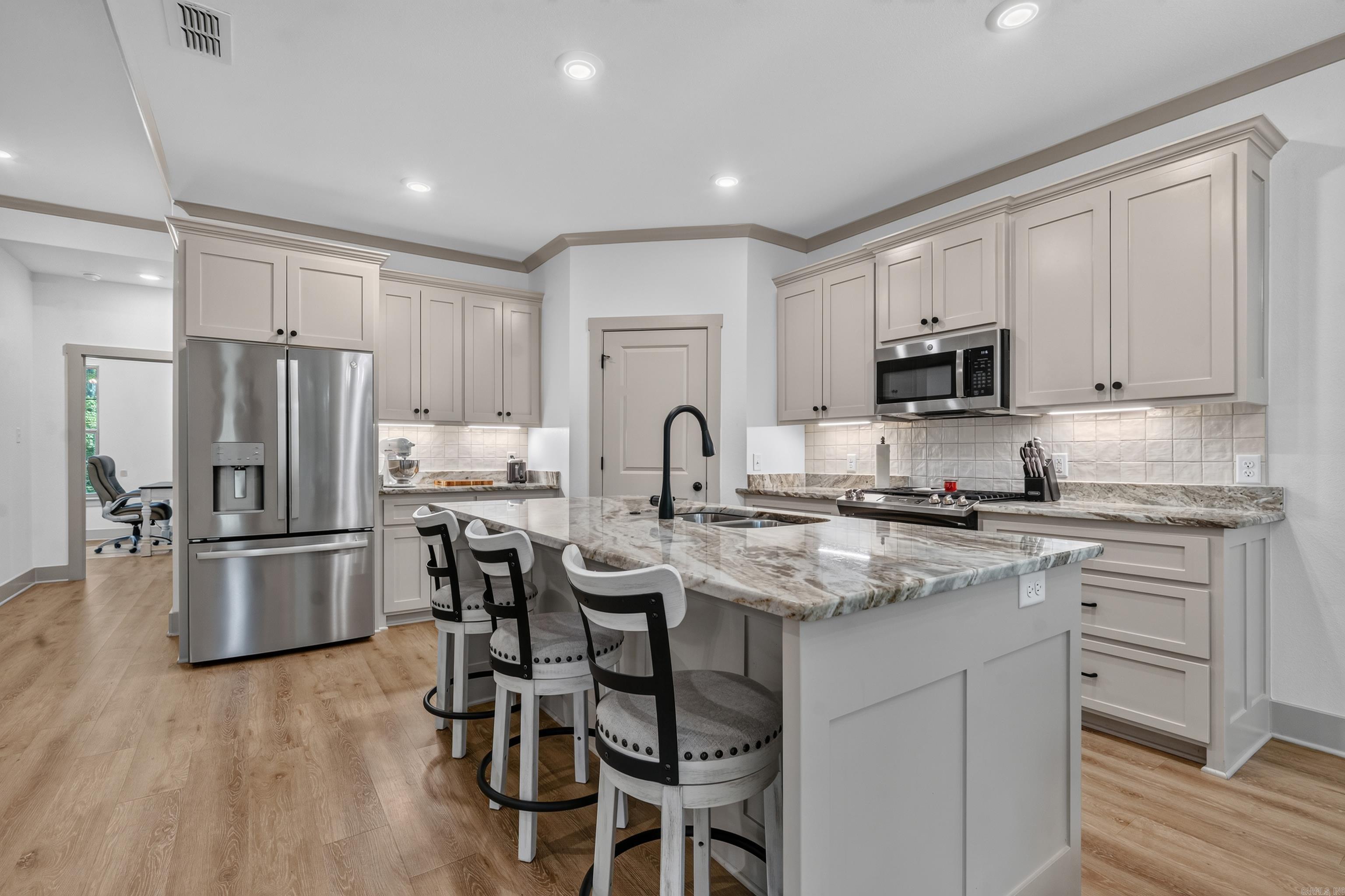 beautiful chef's kitchen with granite countertops