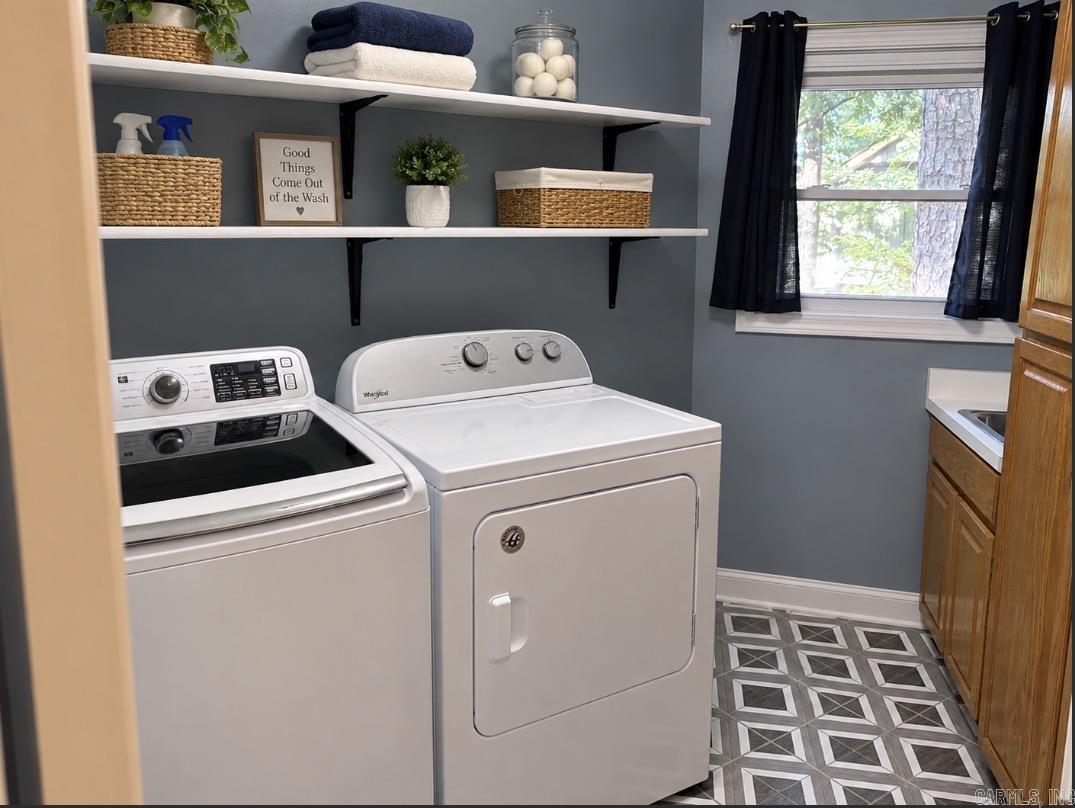 Has a sink and lots of cabinets