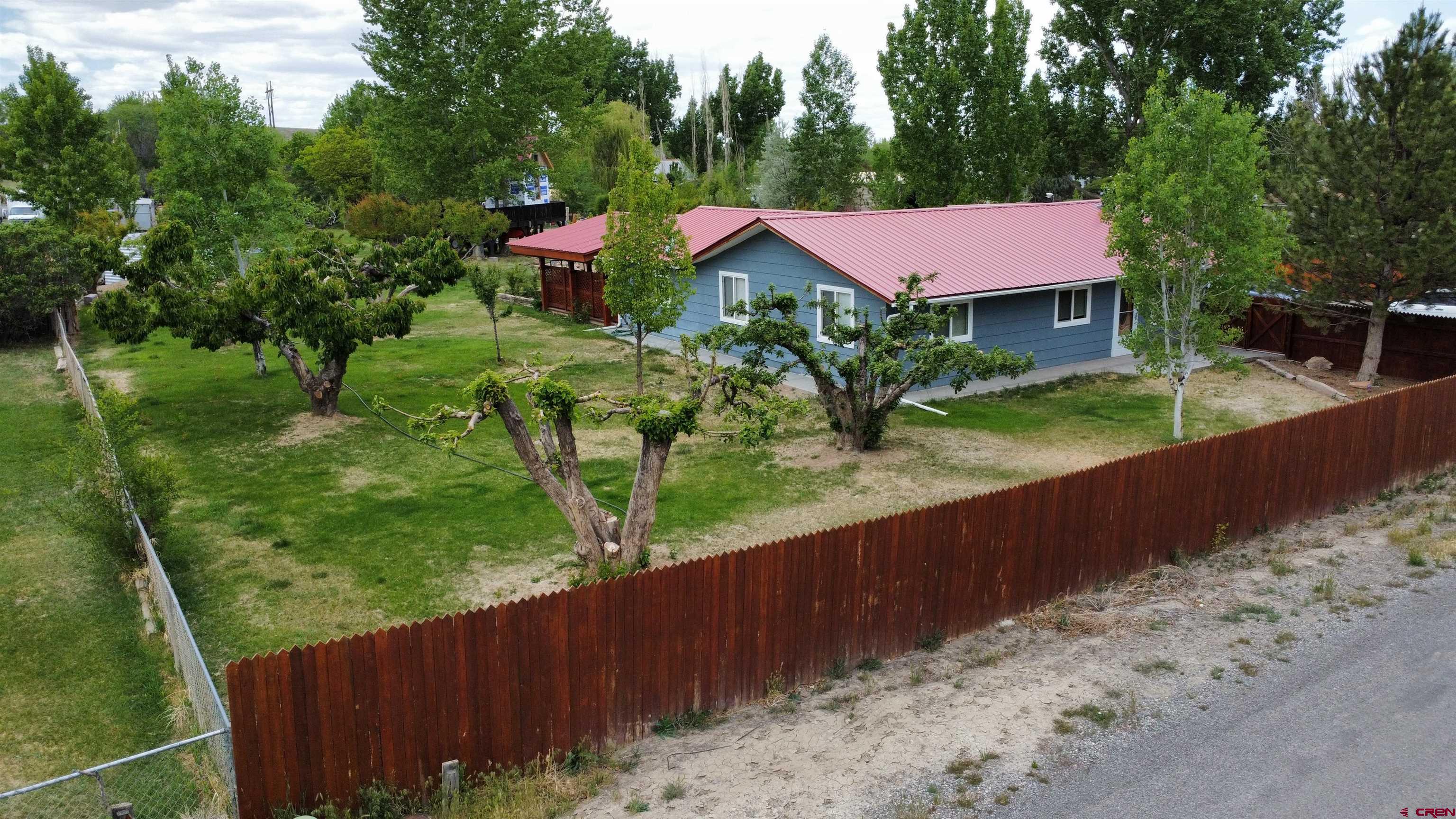 This home sits on .9 acres and features 4 bedrooms,  1 3/4 baths. 1680 sq ft. 2 wood stoves to keep the winter heat bills low. Exterior features Pizza oven, storage shed, work shed, large covered deck area perfect of large gatherings. Open shed for lawn mower and yard tool storage, small chicken coop, lots of mature trees, Large parking area and a Tree house that is just waiting for the new owners finishing touches.