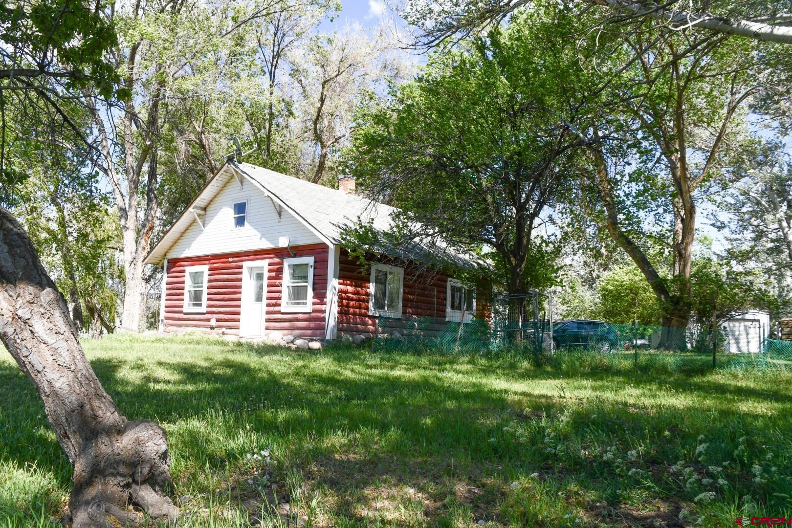 This 85-acre property offers a rare combination of city convenience with a distinctly rural feel, making it both productive today and highly promising for the future. Approximately 45 acres are irrigated, supporting its current agricultural use and providing immediate operational value.    Adding to its charm is a quaint farmhouse, offering a comfortable residence, rental potential, or a perfect base for managing agricultural or equestrian operations.  Despite being within city limits, the land features wide-open space, privacy, and scenic surroundings. The property would also make an excellent horse facility, with ample acreage for pastures, arenas, barns, and riding trails, all while remaining close to city amenities.  The size and layout of the land allow for continued agricultural or equestrian use in the near term, while its location positions it as an outstanding opportunity for future development. With substantial acreage, irrigation, and proximity to city infrastructure and services, the property is well-suited for potential residential, mixed-use, or estate-style development (subject to zoning and approvals).  Whether utilized as a working agricultural operation, a premier equestrian facility, or held as a strategic investment for future growth, this property offers exceptional versatility and long-term potential.