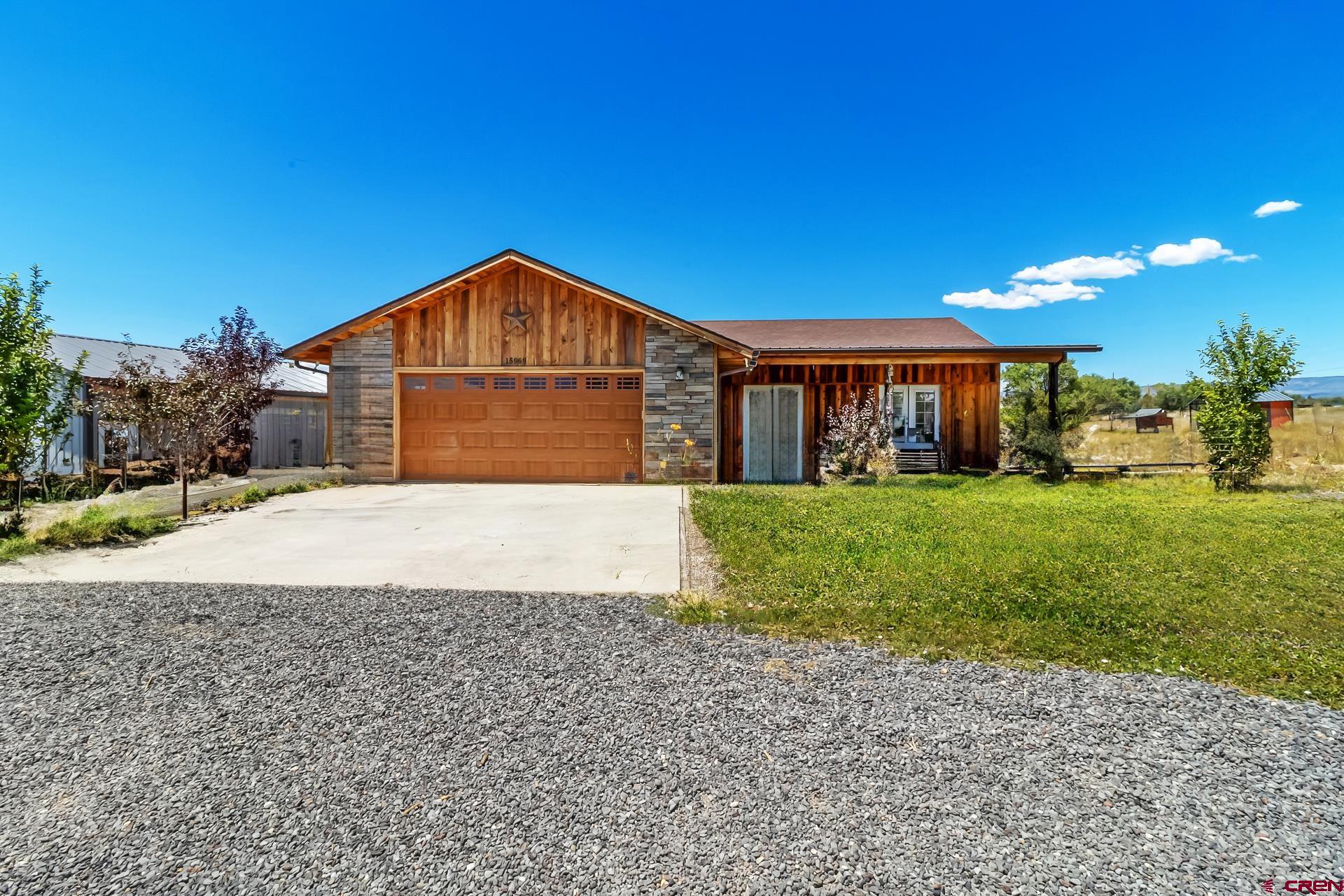 This single level, ranch style home built in 2018 is being offered with exceptional views and good elbow room! With vaulted ceilings and an open concept floor plan, this home is a perfect blend of modern comfort and rural appeal. This home has a bright, open layout and dual patios giving an indoor-outdoor flow to enjoy the Colorado air and mountain views! Outside you will find a nice detached shop with concrete floors and power making it great for hobbies and/or storage. On over 1.6 acres and zoned for livestock there is plenty of room to create your needs! Access is directly off of a paved road, 10 minutes from Cedaredge. This home has been well kept and maintained and is move in ready.