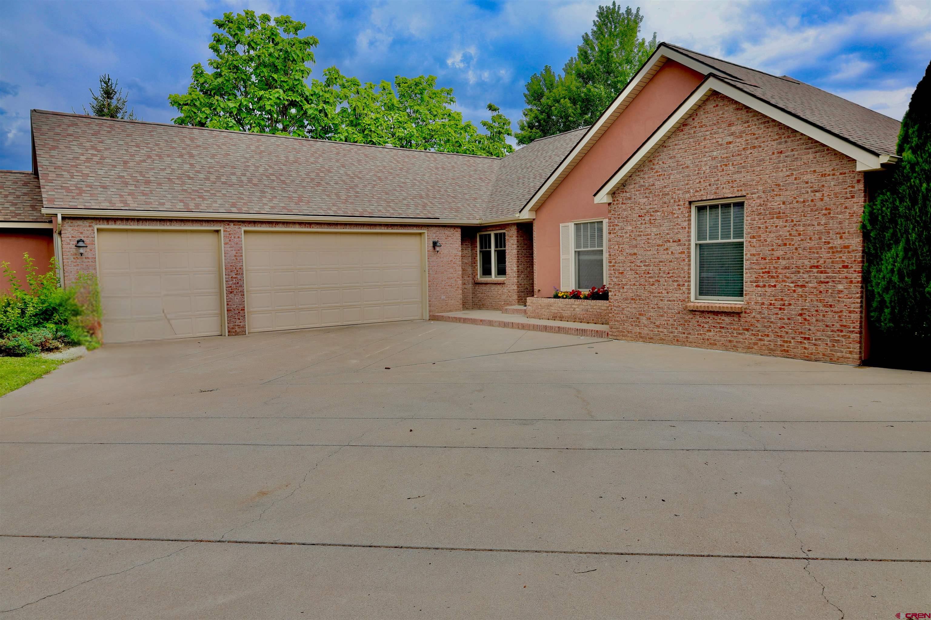 The seller is offering a generous buyer concession, giving you valuable flexibility to buy down your interest rate, cover closing costs, or make personalized improvements.  Welcome to 3924 Mt Hayden Dr, a beautiful 3-bedroom, 2-bath home with 2,206 sq ft of open-concept living on a meticulously landscaped .36-acre lot. The generously sized primary bedroom features a walk-in closet plus additional closet space and a luxurious ensuite bathroom, providing a private retreat. On the opposite side of the home, two additional bedrooms share a full bathroom, offering privacy and comfort for family or guests.  The home also includes an inviting entryway and a bonus room that could easily serve as a fourth bedroom or home office, adapting to your lifestyle needs. Enjoy cozy evenings by the double-sided gas fireplace connecting the living area to the exquisite formal dining room, perfect for entertaining. Step outside to the covered back patio, surrounded by mature trees and a fenced yard, offering a serene and private outdoor space.  Included with the home is a prestigious Cobble Creek Club membership, just a short walk to the clubhouse, featuring a full-service bar and restaurant, spa, yoga studio, gym, pro shop, and golf simulator. Miles of scenic bike trails and single-track paths connect directly to the neighborhood, allowing you to embrace an active lifestyle with breathtaking vistas—without the crowds or hassle.  Experience Montrose’s unmatched weather and seasonal beauty, year-round golf opportunities, and a lifestyle that combines luxury, recreation, and tranquility. This home is more than a residence—it’s your gateway to the ultimate Colorado lifestyle. New Carpet being installed soon! The Club membership costs about $171.67/month in addition to the HOA fees. Some photos of this listing may include virtually staged amenities, furniture or fixtures.