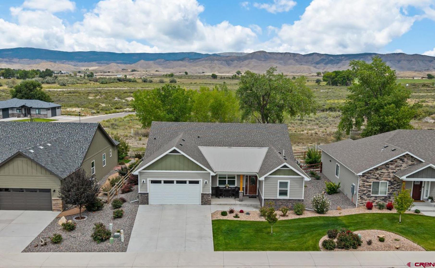 Welcome to the beautiful Brown Ranch community, a quiet neighborhood that truly feels like Colorado, with a park, open spaces, walking paths, and excellent views of the amazing San Juan Mountain Range. INSIDE: This 3 bedroom, plus office, well-built home was constructed by one of the most respected area builders. 9' ceilings throughout, 3-zone climate control, Minke Aire fans, a coat closet, Corian window sills, a large kitchen, and a spacious pantry. This roomy and thoughtful open floor plan provides plenty of space for you to customize to your own taste. The 3 year old home includes the following improvements: Hunter Douglas bi-level shutters in the front windows and HD top-down bottom-up blinds in the great room.  Two contemporary ceiling fans(Minke Aire) in the great room. The split floor plan features a very large 21' x 15' master suite, with two walk-in closets, and a walk out to the 34' wide patio.  Neutral paint and floors are ready for any colors you want to bring into the home. OUTSIDE: Fantastic lot orientation!  In winter, the sun warms the driveway, as well as the two rooms with southern facing windows.  Lush grass in front and behind the home is watered and maintained by the HOA, allowing for worry-free vacations and/or part-time residency. Snow removal for the front of the home is also handled by the HOA. There's plenty of room out back for all of your patio furnishings, for viewing sunrise over the mountains and enjoying cooler east facing evenings.  Brown Ranch incorporates open space within its development and is the ideal location for those looking for a tranquil setting while preserving the convenience of quick access to the best amenities in Montrose.