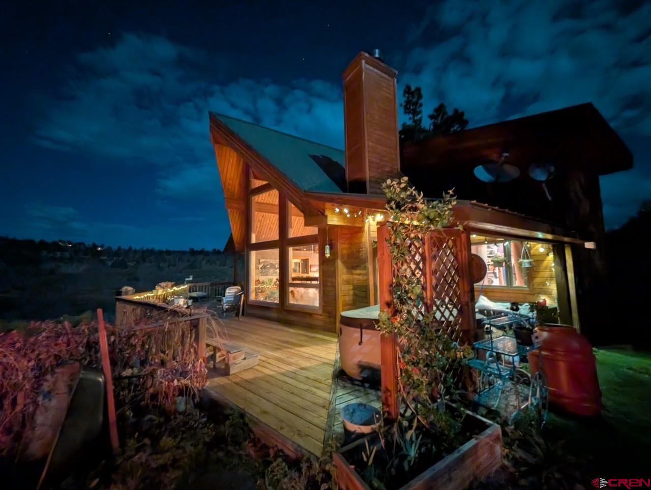 Welcome to a mountain retreat where timeless design meets the untamed beauty of Colorado’s high country. This residence is framed by towering pines and majestic Mt. Sneffels views, offering a rare blend of privacy, comfort, and connection to nature. By day, the home opens to sweeping views of forests, streams, and open skies, as well as private access to the National Forest from the subdivision. By evening, warm light spills across inviting outdoor spaces, creating the perfect setting for gathering or quiet reflection. Thoughtful landscaping adds seasonal color, while nearby water and trails extend the living experience far beyond the walls. Gated access to this mountain property allows for a sense of security. An insulated workshop rounds out the list of benefits. Every detail of the property speaks to a lifestyle defined by serenity, adventure, and an enduring sense of place. More than a home, it is a sanctuary crafted for those who seek both refinement and the restorative power of the natural world.