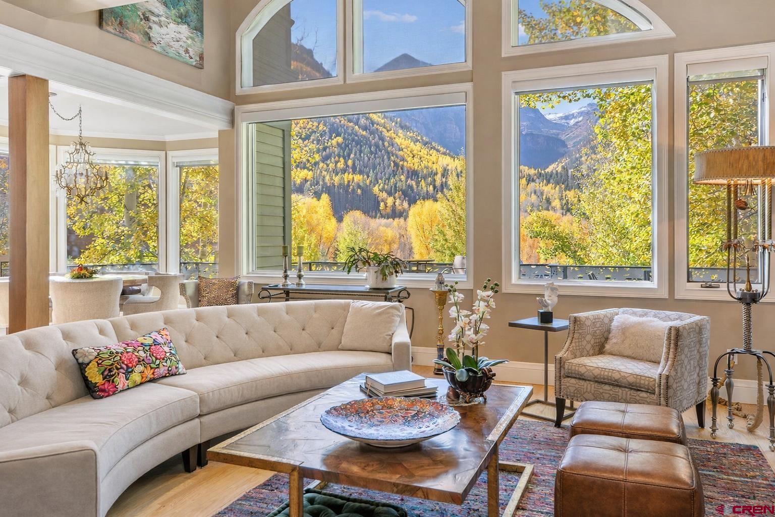 New compelling price. Unmatched panoramic views of Bear Creek Canyon and the San Juan peaks define this iconic Telluride residence. Not historically designated, allowing for easier updates. The contemporary home features floor-to-ceiling windows and two expansive south-facing decks capturing breathtaking mountain vistas. Offering 4 bedrooms, 4.5 baths, and 4,427 sq ft across three levels, the layout flows seamlessly. Entry on quiet E. Pandora Ave; heated 2-car garage and 3 additional off-street spaces via Columbia Ave. Spa deck, loft, wet bar, steam shower, and partial furnishings. Close to Gondola and downtown. Telluride Ski & Golf Silver Membership available.