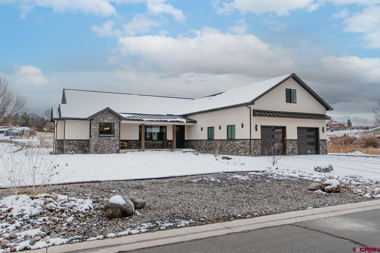 Discover refined Colorado living in this exquisite 2023 custom home, set on a generous half-acre lot within The Brook—one of Montrose’s most coveted subdivisions. Defined by rolling hills, mature trees, and serene community ponds, this enclave offers an unmatched blend of tranquility and prestige. This expansive ranch-style residence features a thoughtful split floor plan on the main level for effortless everyday living, complemented by an upper-level bonus room, a fourth bedroom, and ¾ bath—ideal for guests or recreation.  Exceptional craftsmanship is evident throughout, especially in the stunning great room where the beautifully designed kitchen and oversized island create a true centerpiece for entertaining. Natural light floods the home from both directions—morning sun illuminates the dining room overlooking open space and a peaceful pond, while southern windows brighten the living area and frame views of the private back patio and yard. The luxurious primary suite offers direct patio access and a spa-inspired bath with a freestanding tub, separate shower, and a generous walk-in closet. Guest accommodations are privately positioned on the opposite side of the home with access to an elegant full bath. A large laundry room with an adjoining office/craft/flex space adds everyday convenience, while custom built-in cabinetry near the garage entry provides stylish, practical storage. The oversized two-car garage offers abundant room for vehicles, gear, and equipment. Easily maintain your half area with irrigation water via the HOA with dues of only $430/year.  Enjoy the quiet elegance of The Brook while remaining just minutes from the Montrose Recreation Center, premier shopping, and popular dining. The Montrose Regional Airport is less than 15 minutes away, keeping you seamlessly connected. Perfectly situated for year-round adventure, this home places you within easy reach of the Ouray Hot Springs, world-class skiing in Telluride and Crested Butte, paddleboarding at Ridgway Reservoir, gold-medal fishing on the Gunnison River, and endless trails for hiking, biking, and off-roading. With 245 days of sunshine and the signature blue Colorado sky above, embrace an elevated Western Slope lifestyle and make this exceptional residence your next home.