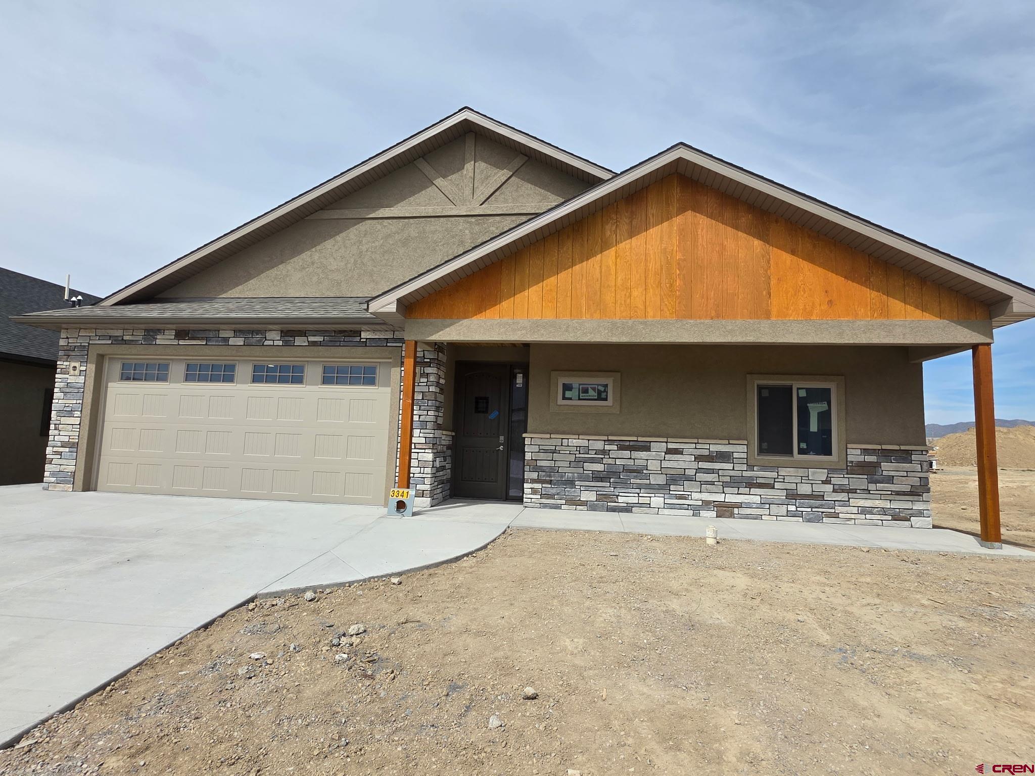 Beautiful New Construction! This thoughtfully designed 4-bedroom, 2.5-bath home offers 2,122 sq ft of quality craftsmanship and modern comfort. Step inside to an inviting open-concept living, dining, and kitchen area, highlighted by a stunning 10-ft kitchen island, 42" custom dovetail upper cabinetry, and soft-close roll-out trays in all lower cabinets—a dream workspace for any home chef.  The spacious living room features a floor-to-ceiling stone gas fireplace, creating the perfect gathering space. The primary suite is a true retreat with in-floor heat in the master bath and beautifully tiled shower and bath areas floor-to-ceiling.  Function meets convenience in the oversized finished garage with an 18-ft door, extra space on both sides, trim and paint completed, and a tankless water heater. The home also includes natural gas forced-air heating, central A/C, and quality finishes throughout.  Enjoy Colorado living outdoors on both the covered front entry and rear patio, accented with attractive blue-stained pine.  Crafted with the attention to detail, this brand-new home offers comfort, style, and durability—Construction to be finished approximately June, 2026.  You still have time for some choices.