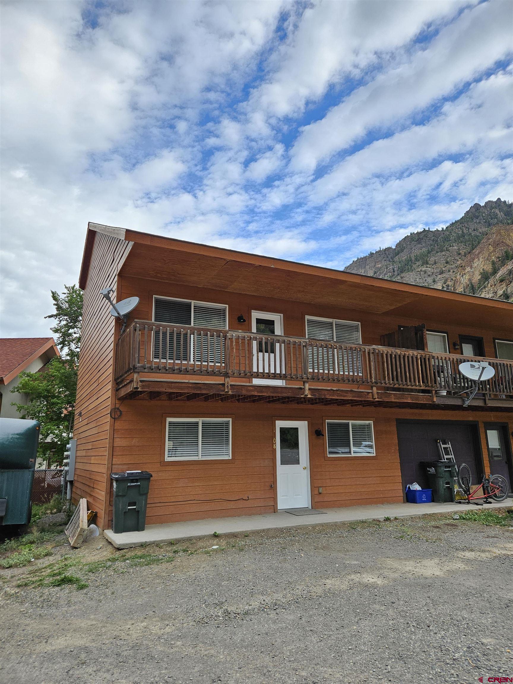 Charming Townhome Near the Uncompahgre River – Walk to Everything Ouray Offers.  Enjoy the best of small-town mountain living in this inviting 3-bedroom, 2-bath townhome just steps from the Uncompahgre River and within easy walking distance to downtown Ouray’s shops, restaurants, parks, and hot springs.  Freshly updated with new carpet, wood blinds and paint throughout, this home feels bright, clean, and move-in ready. The open-concept living area flows out to a south-facing deck, perfect for soaking up the sun or relaxing after a day of adventure.  Whether you're looking for a full-time residence, weekend escape, or investment property, this townhome offers comfort, convenience, and a location that puts the best of Ouray right outside your door.