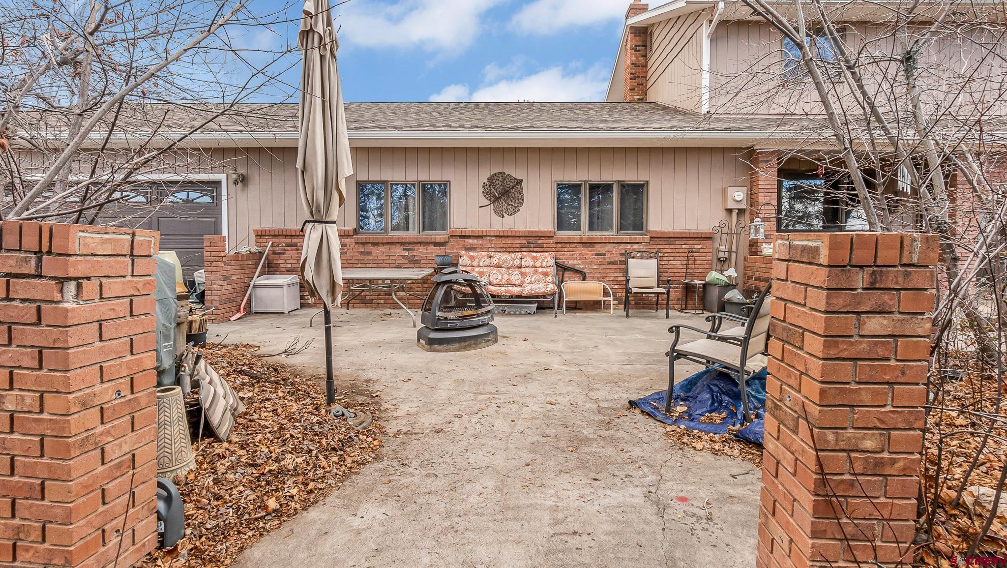 Set on 1.5 acres of peaceful privacy, this large five-bedroom home offers unique character and flexible living. An atrium with formal dining connects to the kitchen, while sunrooms throughout the home create a perfect environment for plant enthusiasts. Three distinct bedroom areas provide separation and versatility. Vaulted ceilings and two gas fireplaces—one in the living room and one in the family room—add warmth and charm. Some updates have been completed, with additional opportunities to make it your own. Home is being sold as is.  Nestled in a beautiful, private setting, this property showcases mature fruit trees—including pear, apple, peach, and plum—alongside stately maples and hardwoods. Gated pipe irrigation and a sprinkler system support lush grounds, complemented by a gardener’s shed and an oversized two-car garage. A peaceful retreat with room to grow and en