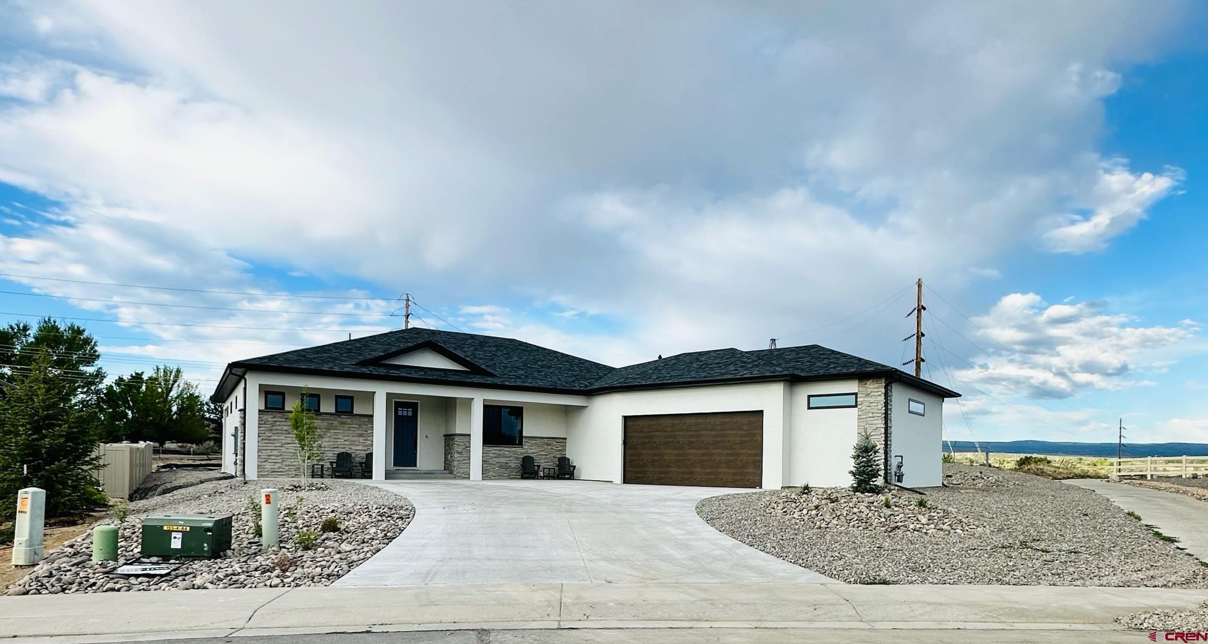 Classic design with modern elements define this beautiful three bedroom, three bath home built in 2023. This home features easy comfortable living with all the upgrades Coker Homes offer.  Bosch appliances, hardwood flooring, open floor plan, Anderson Windows , Quartz countertops name just a few of the features. The attached garage is oversized measuring 988 square feet of space. This home sits on a larger lot, nearly 1/2 acre,  fully landscaped with views to the Southwest from the covered patio.  All this and close to shopping, Montrose Recreation Center and bike/walking paths. Winter sports are at your doorstep as well. Make this your next home and enjoy all that Montrose has to offer.