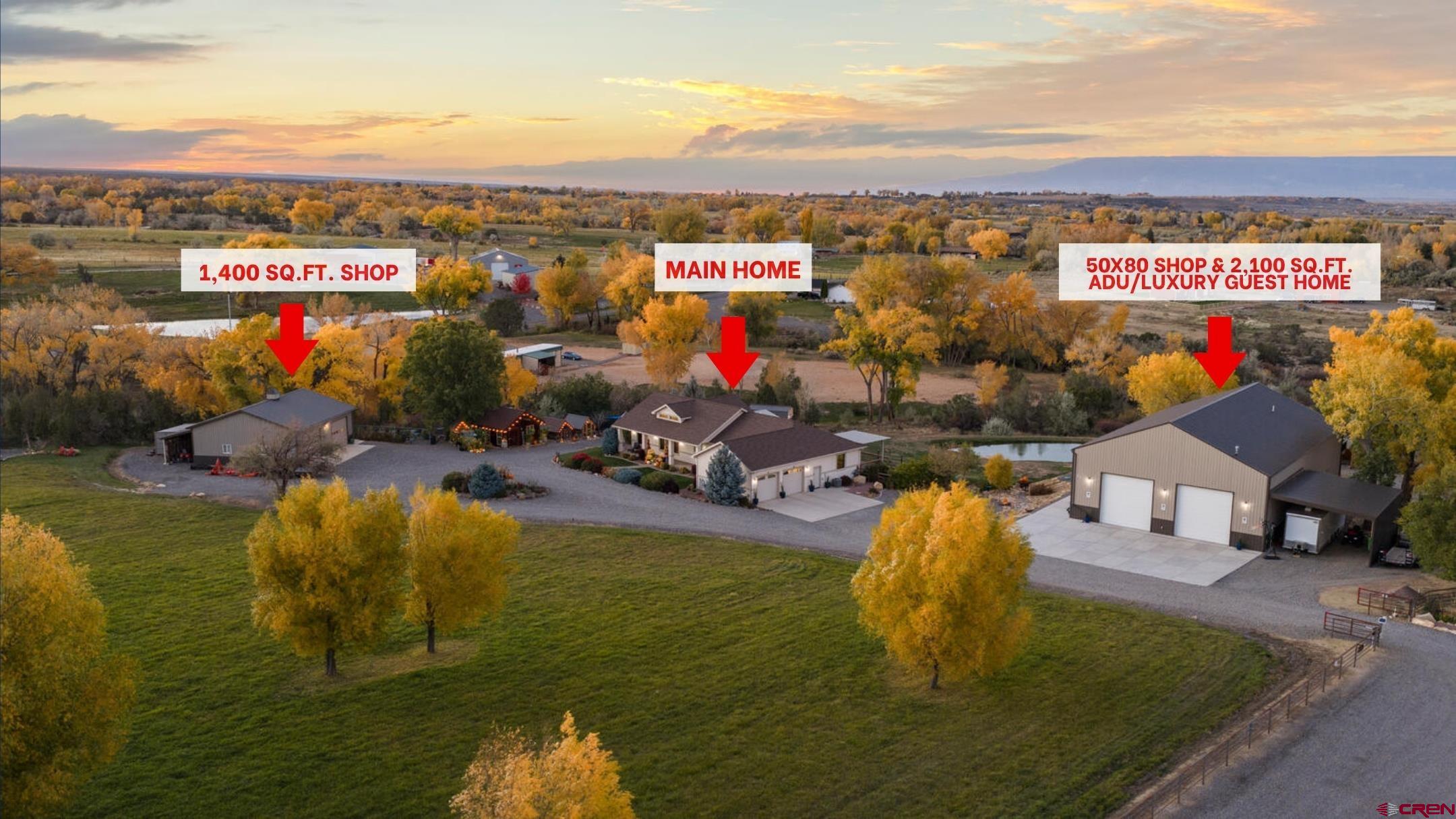 MONTROSE JUST GOT LOUD!! Two addresses, Two homes, and ONE EPIC LIFESTYLE! 60075 & 60085 Oak Grove Road is a rare, gated, 4+ acre compound with no HOA and features a combined total of 6 bedrooms, 5 bathrooms and over 4,200+ sq. ft of living space that delivers the full trifecta of luxury, land, and legendary living! It's where horses meet horsepower and every dream you’ve ever had suddenly has an address! The main residence isn’t just built-it’s crafted and is a 2,100 sq.ft. 3-bedroom, 2.5-bath ranch-style stunner built by Western Slope icon Paul Sinner. It is the perfect mix of mountain serenity & high-end sophistication. Every detail was designed to impress—from radiant-floor heating throughout, that keeps toes toasty year-round, to vaulted ceilings and sunlight soaked rooms that make the space feel limitless. Fresh paint, plush new carpet, and custom plantation shutters add a refined touch, while the kitchen brings the heat with stainless-steel appliances, gleaming granite countertops, double ovens, and a brand-new refrigerator. Just off the kitchen, you’ll find a spacious walk-in pantry, a convenient half bathroom, and a well-appointed laundry room designed for both function and style. Off the main living area, two additional guest bedrooms (one of which has been virtually staged) and a full bathroom provide comfort and privacy for family or visitors. The Primary Suite is where style meets swagger—dual closets, dual vanities, a tub made for bubbles and playlists and a large walk-in shower. Enjoy the direct access to the brand new trex deck-half shaded, half sun-kissed, and already wired for your future hot tub happy hour. It’s the ideal backdrop for al fresco dining, weekend BBQs, or sunrise coffee with mountain views. A fenced-in dog run gives Fido and friends room to roam. Just steps away is the real showstopper: The jaw-dropping, heart-thumping, heated and fully insulated 50x80 fully permitted GARAGE MAHAL—the undisputed crown jewel of Colorado horsepower heaven! This is where utility meets pure adrenaline. Outfitted with two 14-ft and two 12-ft roll-up doors, its own bathroom, an RV dump, and an attached lean-to, it’s a flex space built for boats, RVs, rock crawlers, ATVs, trailers, and an entire car collection—because one toy just isn’t enough! Every inch is engineered for performance and precision! A private, interior entrance  leads to the attached 2,000+ sq. ft. ADU/private guest house—plus a separate exterior entrance for complete independence and privacy. Inside, this luxury guest residence impresses with three bedrooms, two bathrooms, and dual Primary Suites—one conveniently located on the main level with laundry and another upstairs with walk-out access to the Trex deck and sweeping Uncompahgre valley views! A fourth non-conforming bedroom with Pergo flooring—currently used as a craft room (has been virtually staged) would make the perfect home office or studio. Complete with its own septic system and separate address, this ADU offers full independence for guests, in-laws, or rental income potential. It’s the ultimate guest trap— good luck getting anyone to leave! Think you’ve read it all? Think again! This property keeps the plot twists coming with a second 1,400+ sq. ft. insulated outbuilding with a lean-to and RV hook-ups, loafing shed, and 2.5 acres of fenced and irrigated grass pasture ready for horses or hobby farming. A private stocked pond sparkles at sunrise, while a greenhouse, four chicken coops, and fruit-loaded orchard deliver farm-to-table perfection. With 50 bales of hay per cutting, a two-story fort for kids or kids at heart, and a studio for art, fitness, or focus, this isn’t just a place to live—it’s a story waiting to be told.