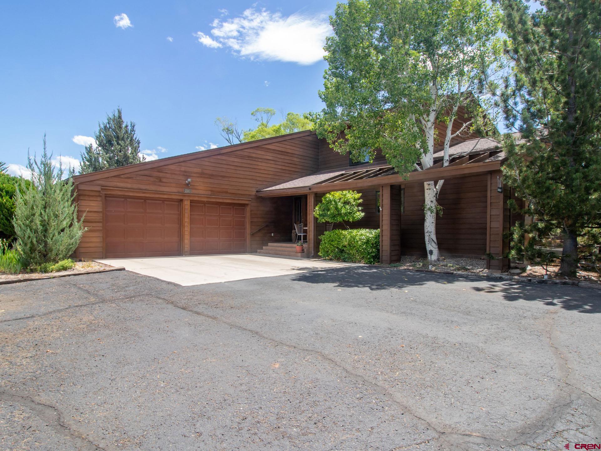 Tucked away at the end of a quiet cul-de-sac, this exceptional 4-bedroom, 2.5-bath home sits on a beautifully landscaped ~0.871-acre lot with irrigation water and breathtaking views of the San Juan Mountains. The home features vaulted ceilings and an open-concept floor plan that seamlessly connects the living room, kitchen, and dining area—perfect for everyday living and entertaining. A cozy fireplace anchors the main living space, while hardwood floors add  durability and style throughout key areas. The sunroom is a true highlight, offering vaulted ceilings, large picture windows, tile flooring, and a hot tub—creating a relaxing space to enjoy the mountain scenery year-round. A spacious, private deck extends the living space outdoors and overlooks the expansive backyard, complete with mature landscaping and a charming treehouse. In addition to the four well-appointed bedrooms, the home includes a massive hidden storage room discreetly located behind one of the bathrooms, providing abundant space for organization. The property offers excellent functionality with a two-car attached garage, a detached ~615 sq ft RV garage with electricity.   In addition to the RV storage, there is an additional outbuilding that provides ample space for horses or a hobby farm, this versatile property combines privacy, views, and room to grow—ideal for those seeking a  peaceful lifestyle with endless possibilities.