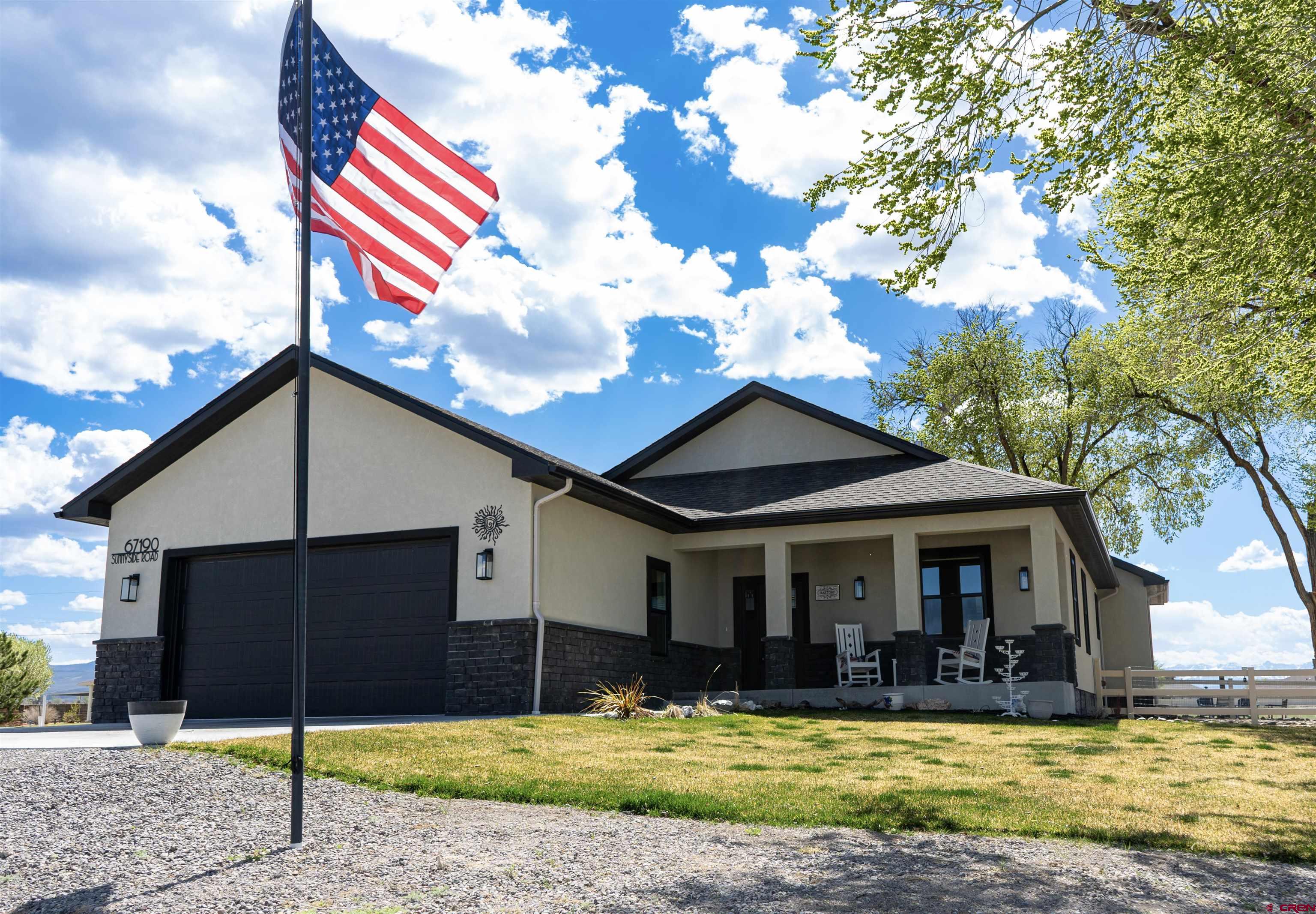 Join us for an OPEN HOUSE this Saturday, 4/18/2026 11:00am to 3:00pm.  Beautiful 2023 built home on 1.56 fully irrigated acres in Montrose Colorado. This 3 bedroom, 2 bathroom home has a functional open floor plan with quality upgrades and modern finishes. With KitchenAid appliances and granite countertops, it’s designed for durability and comfort. Double-pane Anderson windows bring in plenty of natural light, creating a comfortable space for everyday living and entertaining. The property features a Rain Bird sprinkler system, lush irrigated lawn, temperature regulated greenhouse, and raised garden beds, making it ideal for gardening, hobby farming, or enjoying Colorado outdoor living. Enjoy stunning views of the San Juan Mountains from your finished back patio and relax on the covered front patio during slow mornings or summer evenings. The acreage is flat, usable and well maintained, offering privacy and room to expand. With no HOA or covenants, enjoy the freedom to fully embrace your property. Conveniently located minutes from downtown Montrose with easy access to shopping, dining, medical facilities, and Montrose Regional Airport. Enjoy nearby outdoor recreation including fishing, hiking, biking, and skiing with Telluride Ski Resort just a short drive away. A great opportunity to own a newer home with acreage, irrigation water, and proximity to both town amenities and mountain recreation in Western Colorado.