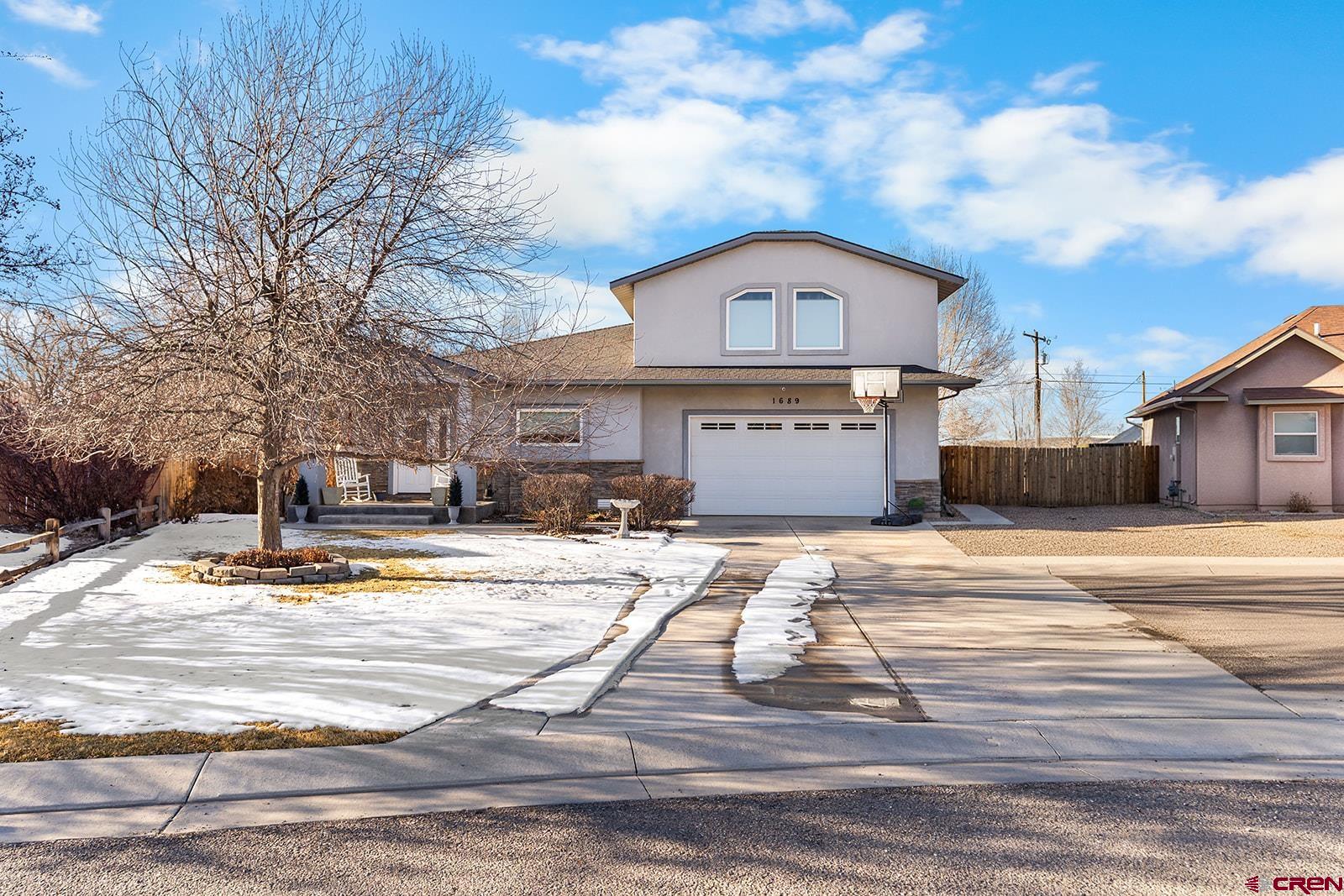 Tucked away on the southwest side of town on a quiet circular street, this inviting 3-bedroom, 2-bath home offers comfortable main-floor living with the added bonus of a spacious upstairs media/bonus room. The thoughtfully designed layout welcomes you with a beautiful living room featuring abundant natural light, a coffered ceiling with recessed lighting, and a ceiling fan for added comfort. The dining area provides generous space for hosting and flows seamlessly into the open kitchen, where a convenient breakfast bar offers additional seating—perfect for gatherings. Step outside through the sliding glass door off the dining area to the back patio, making indoor/outdoor entertaining effortless. The kitchen is finished with beautiful cabinetry topped with crown molding, stainless steel appliances, and a window over the sink overlooking the backyard. A large pantry and laundry room just off the kitchen provide excellent storage and functionality. Red oak hardwood floors accent the living room and hallway, with tile in the kitchen and baths and plush carpet in the bedrooms and bonus room. All bedrooms feature ceiling fans for year-round comfort. The main-floor primary suite includes private access to the back patio, a custom tiled shower with Euro glass door, a separate jetted tub, and a walk-in closet. A second full bath offers a tiled shower and additional storage. Upstairs, the oversized bonus/media room provides flexible space for entertainment, work, or guests, along with even more storage. Additional features include a finished 2-car garage, a longer driveway with extra side parking, and a large, fully fenced backyard. Located within the Cottonwood and Columbine school areas and just minutes from downtown or the south side of town, this home combines peaceful living with everyday convenience.  Make lovely home your next home.