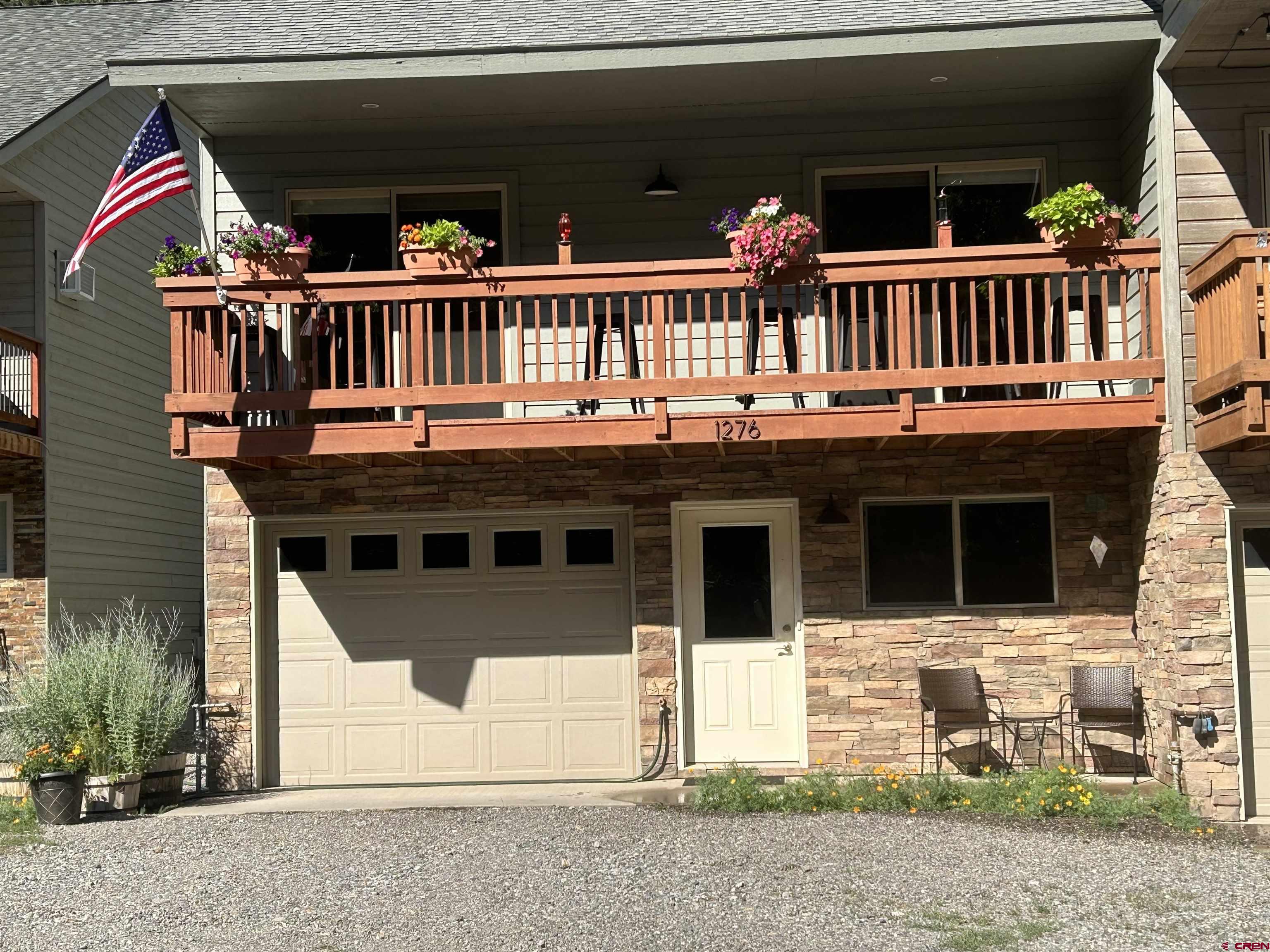 Nestled in the heart of Ouray, furnished townhome offers comfort, scenery & exceptional location. New LVT flooring, interior & exterior paint. A welcoming living area with a stone fireplace & abundant natural light throughout. The open layout extends to a front & back balcony with seating, creating a perfect place to relax while enjoying the peaceful setting of the property backing up to the Uncompahgre River. Mountain inspired architecture blends seamlessly with the surrounding canyon walls & towering pines, while the central location places you just moments from Main Street shops, dining, trails, & all that Ouray has to offer. Move in ready and being sold furnished, this townhome is an ideal primary residence, second home, or mountain retreat. Short term rental & VRBO, Air BNB are allowed, need to get approval from City of Ouray.