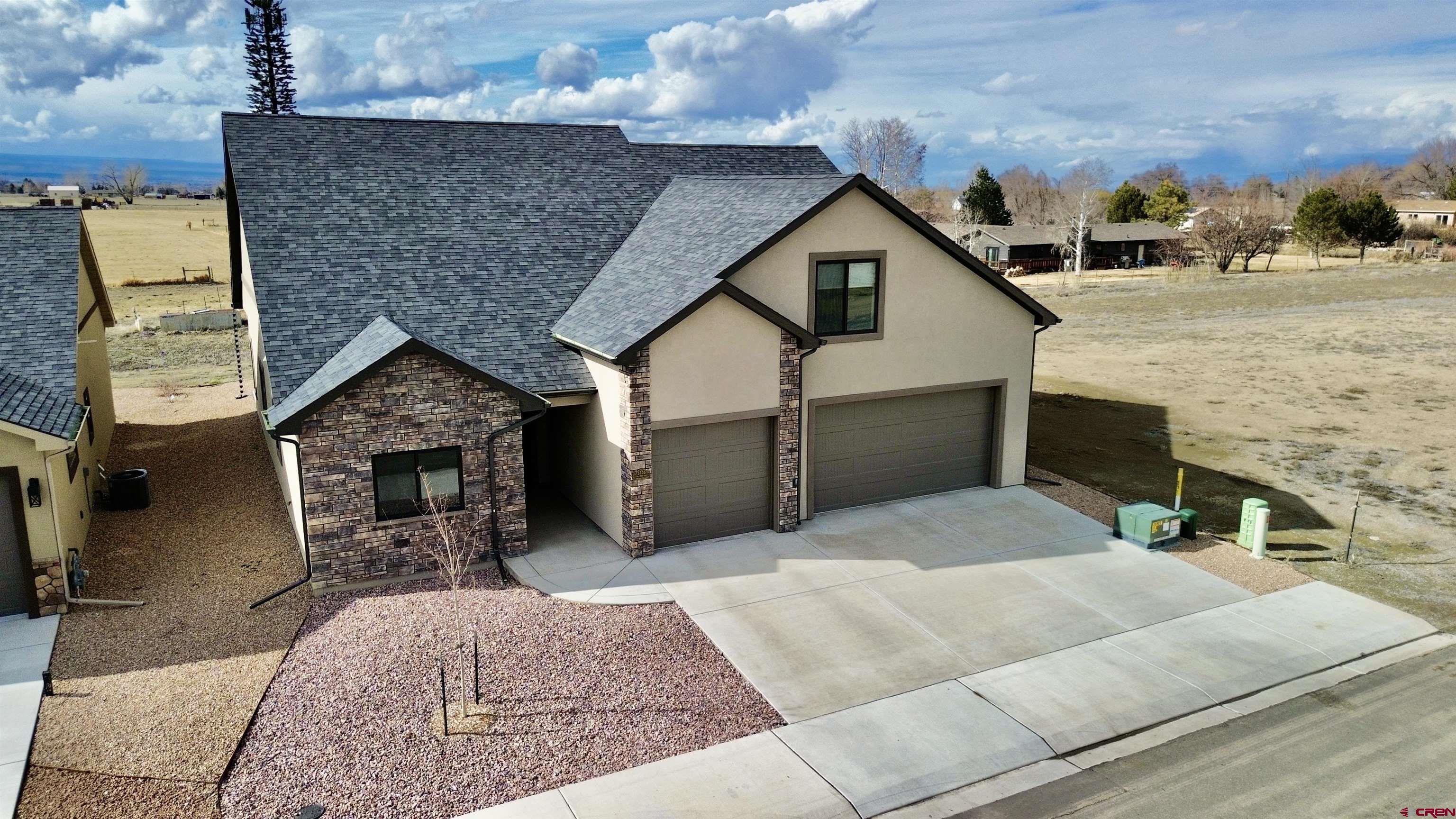 Welcome to this beautifully built home in the highly desirable Woods Crossing neighborhood of Montrose. Built by Cypress Homes LLC and first occupied in March 2025, this home still feels brand new and is completely move-in ready. Offering 3 bedrooms, 2 bathrooms, and 2,347 square feet of thoughtfully designed living space, the layout provides both functionality and comfort. The large kitchen serves as the heart of the home, featuring an open-concept design that flows seamlessly into the main living and dining areas, creating an inviting space ideal for both everyday living and entertaining. Upgraded features throughout add style, quality, and modern appeal. Upstairs, a spacious bonus room adds flexibility for a home office, media room, playroom, or guest retreat. Located just minutes from downtown Montrose, you will enjoy quick access to shopping, dining, schools, parks, and all the amenities that make this community such a great place to call home. Modern construction, a desirable floor plan, and a prime location in Woods Crossing make this a standout opportunity. Schedule your private showing and experience it for yourself.