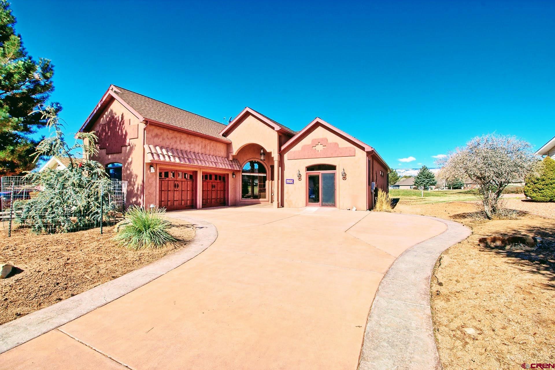 Enter the Land of Enchantment Right Here on the Cedaredge Golf Course! This Magnificent Custom Authentic Santa Fe Spanish Style Home has a Magical History behind it. It was Completely Custom Built to Reflect the Owner's Santa Fe & Spanish Heritage & Culture.  As You Enter through the Large Custom-Built Impressive Front Door that Pivots when Opening, You Will think You are in Santa Fe. Meticulous Attention to Detail has been taken in Every Area of this Home, from the Structural Insulated Panels Construction to Decor, with Many of the Materials being Imported from Santa Fe, from the Latillas in the Ceiling in the Great Room, Bark Peeled Wooden Beams in the Ceiling in the Main Bedroom, Spanish Accent Tiles Throughout the Great Room and into the Kitchen & Dining Room to Mirrors & Many Accent Materials.   All Doors and All Cabinets throughout the Home are made of the Popular Alder Wood and All Doorways are Wide for Wheel Chair Access, if needed. The Spacious Kitchen is a Dream Kitchen for Any Cook with the Adjacent Dining Area that Features Built in Custom Upholstered Benches. The Very Spacious Main Bedroom Features a 5-Pc Ensuite Bath with Steam Shower and also Doors that Open to the Back Patio. One of the Additional Bedrooms includes a Bed, Closet & Cabinet Unit that Folds Up to the Wall, thus Making it Handy for Other Purposes if Desired. The 3rd Bedroom Encompasses the Entire Upper Level, giving you a Very Spacious, Separate & Private Area with its own Bath. The Office is an Open Yet Distinctly Separated Area that Features 2 Walls of Built-in Bookcases.