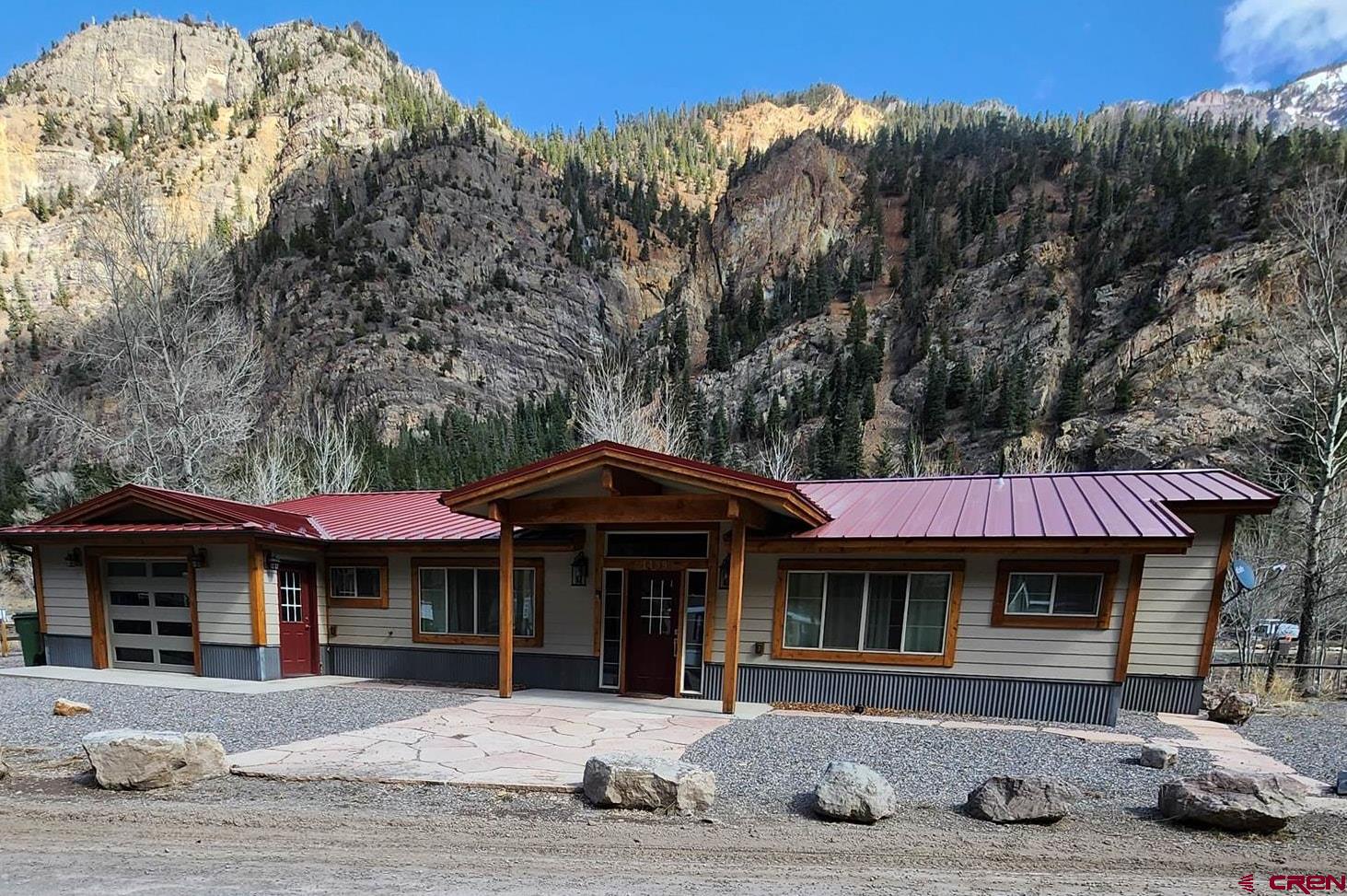 Very spacious nice 3 Bedroom,3 Bath Ranch Home built in 2021. It is a one level ranch with nice back small patio deck that  overlooks the Uncompahgre River. Only 1 mile from town and a walking path 20 feet from the house. Heating is by 4 mini-splits. One in each bedroom and one in the living area. There are electric backup heating units throughout the house. Contemporary furniture throughout the house. Furniture is included in the purchase.  This can be a short term rental unit. License is not transferrable. Contact the City of Ouray for STR information. The house was used as a STR rental for several years.
