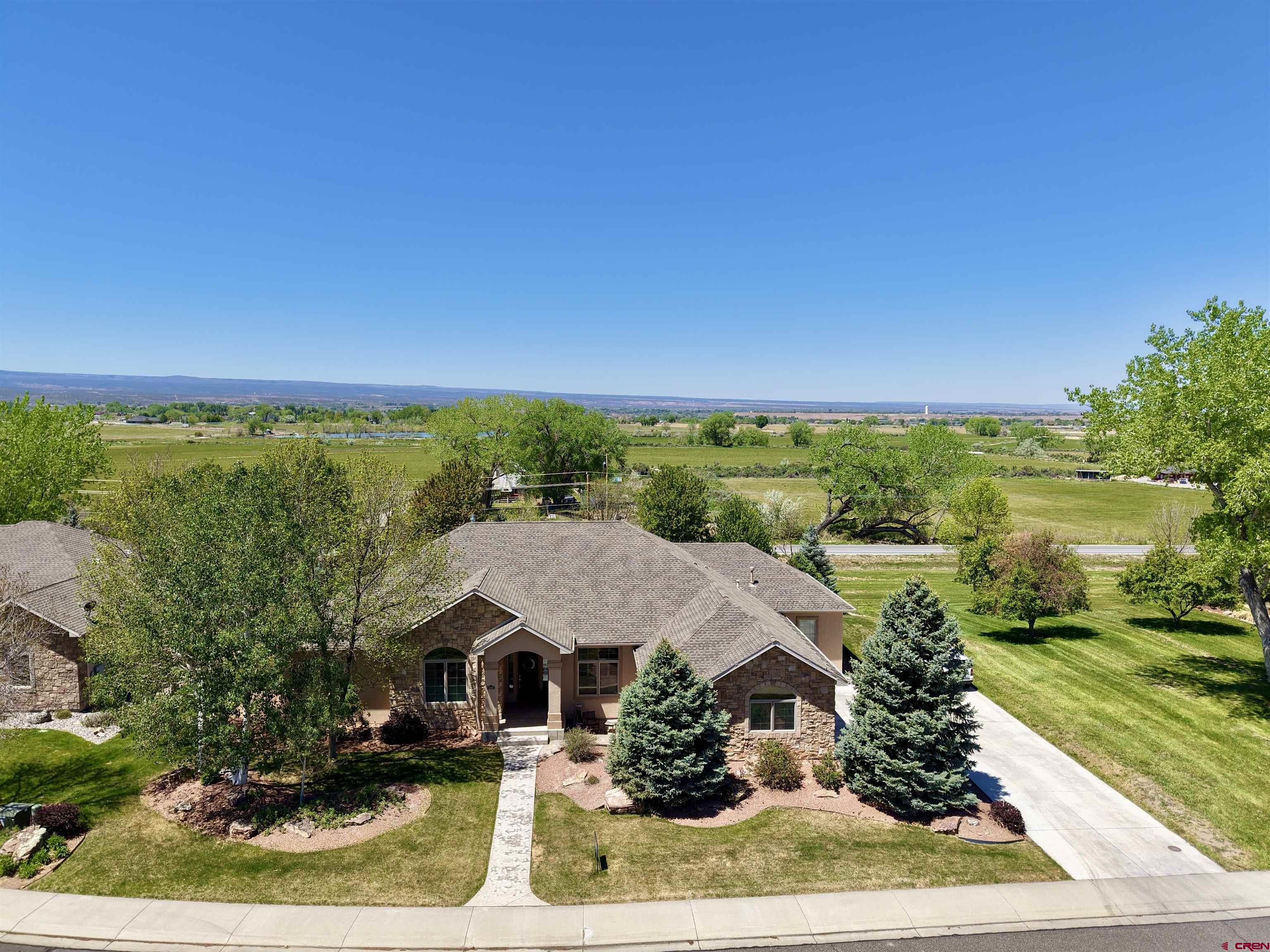 Discover a rare gem in the original heart of the highly coveted Brown Ranch subdivision—a custom-built ranch-style home with an oversized 3-car attached garage that embodies timeless elegance and thoughtful design. From the stamped concrete walkway up to the stone and stucco exterior, the quality details really set this home apart inside and out. A well-balanced and comfortable 2,812 square feet with a desirable split floorpan, the home offers wide hallways leading to 4 spacious bedrooms, plus a versatile office/flex room perfect for remote work, hobbies, or lounging. A large breakfast nook and formal dining area on each end of the granite-adorned kitchen provide a comfortable and logical flow for food prep and social engagement. Indulge in the expansive primary suite, a true retreat featuring a generous walk-in closet equipped with its own dedicated washer and dryer for ultimate convenience. Throughout the home, custom alder wood cabinetry harmonizes with a blend of white oak, slate, and travertine tile flooring, while oversized 8-foot solid doors and a majestic stone-surround fireplace elevate the ambiance with unparalleled style and craftsmanship. A generous 0.357-acre lot benefits from cost-effective irrigation water to maintain its lush, mature landscaping in pristine condition. Adjacency to community open space on the side and rear enhances the sense of seclusion and expansiveness, with a fully fenced backyard ensuring privacy. Step onto the west-facing covered back patio, where breathtaking sunsets unfold over nearby fields where grazing wildlife and livestock roam yet you’re just minutes away from the amenities of town. Complete with a relaxing hot tub, adjustable sun shade, and two oversized sliders—one granting effortless access to the living room and kitchen, the other directly to the primary suite—this outdoor space is designed for year-round enjoyment and effortless indoor-outdoor living. Opportunities like this in the original Brown Ranch are fleeting—don’t miss your chance to own a slice of serenity and sophistication in one of the area’s most desirable enclaves. Schedule your private viewing today!