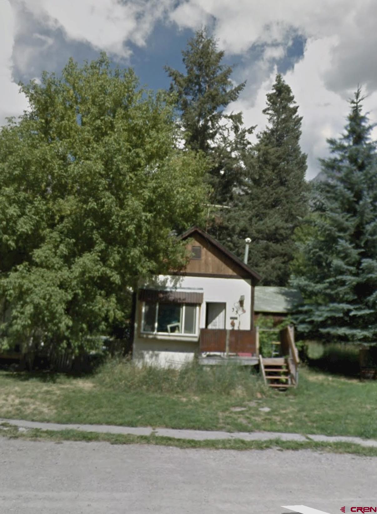 This is your opportunity to create your Ouray dream with this existing home, or build your new home!  This lot and property offer close proximity to Main St, with parking access in both the front and rear of the property.  This property encompasses two city lots, making it 50' wide.  It is Buyers responsibility to investigate all things required for any demolition, development, or remodeling.  Zoning for this property is R-2, which allows both short term rentals, as well as high density residential opportunities, all subject to City approval.  Existing homes current condition would require substantial repairs.    All information deemed reliable, buyer to verify any and all information.
