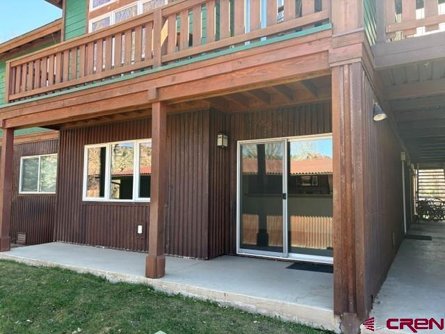 Affordable Living in the Heart of Ridgway – Gateway to Ouray & Telluride!  Discover an exceptional opportunity to own a thoughtfully designed and highly efficient condo in one of Colorado’s most desirable mountain communities. Perfectly positioned for easy walking and biking access to downtown Ridgway, this inviting lower-level unit offers the ideal blend of convenience, comfort, and affordability—an increasingly rare find in the San Juan Mountain region.  Step inside to a smart, functional layout that maximizes every square foot. The well-appointed kitchen greets you at the entry, featuring quality cabinetry, appliances, and a raised counter perfect for casual dining or entertaining. The open living and dining area is filled with natural light and flows seamlessly to a private patio—partially covered for year-round enjoyment—where you can step directly onto beautifully maintained green space.  While tucked on the quiet back side of the building for added privacy, this location offers immediate access to lush lawns, a peaceful pond, and community recreation areas—perfect for enjoying Ridgway’s relaxed outdoor lifestyle.  The spacious bedroom provides great natural light and generous closet space, complemented by a full bathroom and in-unit washer and dryer for ultimate convenience. A high-efficiency furnace adds to the home’s overall comfort and cost-effectiveness.  Additional highlights include:  Easy, near-level access with minimal steps Convenient parking just outside your door HOA covering exterior maintenance, water, sewer, trash, and landscaping Proven construction quality and long-standing desirability  Whether you're seeking a full-time residence, a lock-and-leave mountain getaway, or an affordable entry into the thriving Ridgway, Ouray, and Telluride markets, this property delivers outstanding value and lifestyle appeal.  Live where others vacation—minutes from world-class hiking, biking, hot springs, skiing, and the unmatched beauty of the San Juan Mountains.  Don’t miss your chance to own in Ridgway—schedule your showing today!