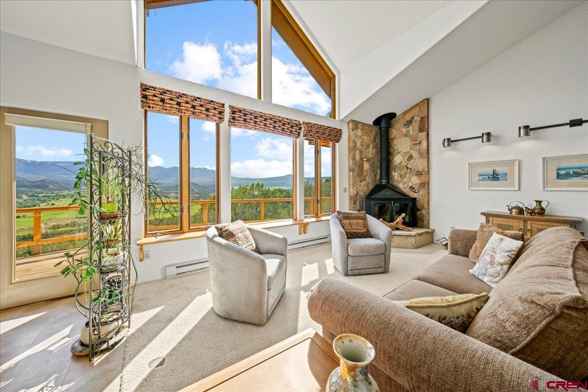 When you imagine your dream home in Colorado, it’s all about the views—the kind that stop you in your tracks every single day. This is where those dreams become reality.  From your living room windows, take in the iconic silhouette of Mt. Sneffels, perfectly framed like a masterpiece. Sweep your gaze across the vast San Juan and Cimarron mountain ranges, where evenings can deliver a show—Chimney Peak and Courthouse Mountain glowing in shifting hues of gold, orange, pink, and lavender during breathtaking alpenglow.  Set on 39 private acres in Pleasant Valley, this 3-bedroom, 2-bath home offers unmatched serenity with no HOA and no covenants. There is a 2 car attached garage, as well as a large one car detacted garage/workshop.  Paved access ensures year-round convenience, while the expansive setting provides the perfect opportunity to maximize solar energy potential. A solar hot water system is already in place, supporting a sustainable mountain lifestyle.  Step outside your door and into adventure—hike, bike, run, or simply explore the surrounding beauty right from your own land.  Despite its privacy, this home is ideally located just 10 minutes to Ridgway, 40 minutes to Telluride,  30 minutes  to Montrose Regional Airport.  Whether you're seeking a full-time residence, a retreat, or a basecamp for mountain living, this property delivers the rare combination of big views, privacy, and accessibility. This is more than a home—it’s your front-row seat to the San Juans.