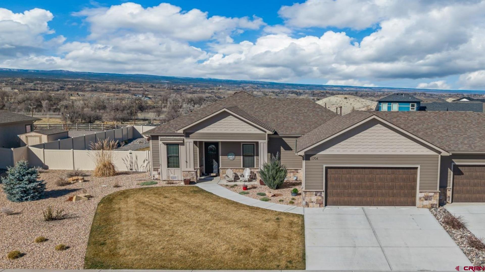 Pristine, Elevated Townhome Offering with Astounding Views, High-End Construction, Perfect Location and All the Convenience in the World! Live your best Western Colorado lifestyle and allow someone else to handle this details and maintenance of your home in this lock and leave property. Step inside to gorgeous craftsmanship framed by outstanding and expansive views, the ideal setting for the peaceful and tranquil life you've been dreaming of. A strategic and versatile floor plan delivers privacy for guests, endless entertaining possibilities, and an ease of living you will come to treasure over the years. The kitchen's ergonomic design is complemented with custom features and luxury amenities such as knotty-alder, soft-close cabinetry, beautiful quartz countertops, a large pantry, under-cabinet lighting and Bosch appliances. The en-suite features a stunning and oversized walk-in shower with hand-helds and a bench, and the walk-in closet provides excellent storage options and built-ins. The benefits continue with additional storage with a guest room walk-in closet, a dedicated laundry room to keep the mess out of sight, and easy to maintain, vinyl plank flooring. The 3rd bedroom/office could function as the perfect home gym or study, or den. The garage is oversized and would accommodate larger vehicles with ease, and has a sink with extra room to tinker. Step outside and catch a vision for peace and relaxation like you've never known; an extended, covered patio, a hot tub and grill ready to go, a large yard with extra side yard space for whatever you're bringing with you, and absolutely mesmerizing views of southwest Colorado. This exceptional property only gets better with the one feature you can't change - location. Minutes' walk to world-class recreation center with classes and community galore, parks and walking paths, unmatched healthcare, big box and boutique shopping, as well as a budding restaurant scene, everything you need is right there. Make the Dream a Reality; Take a Tour Today!