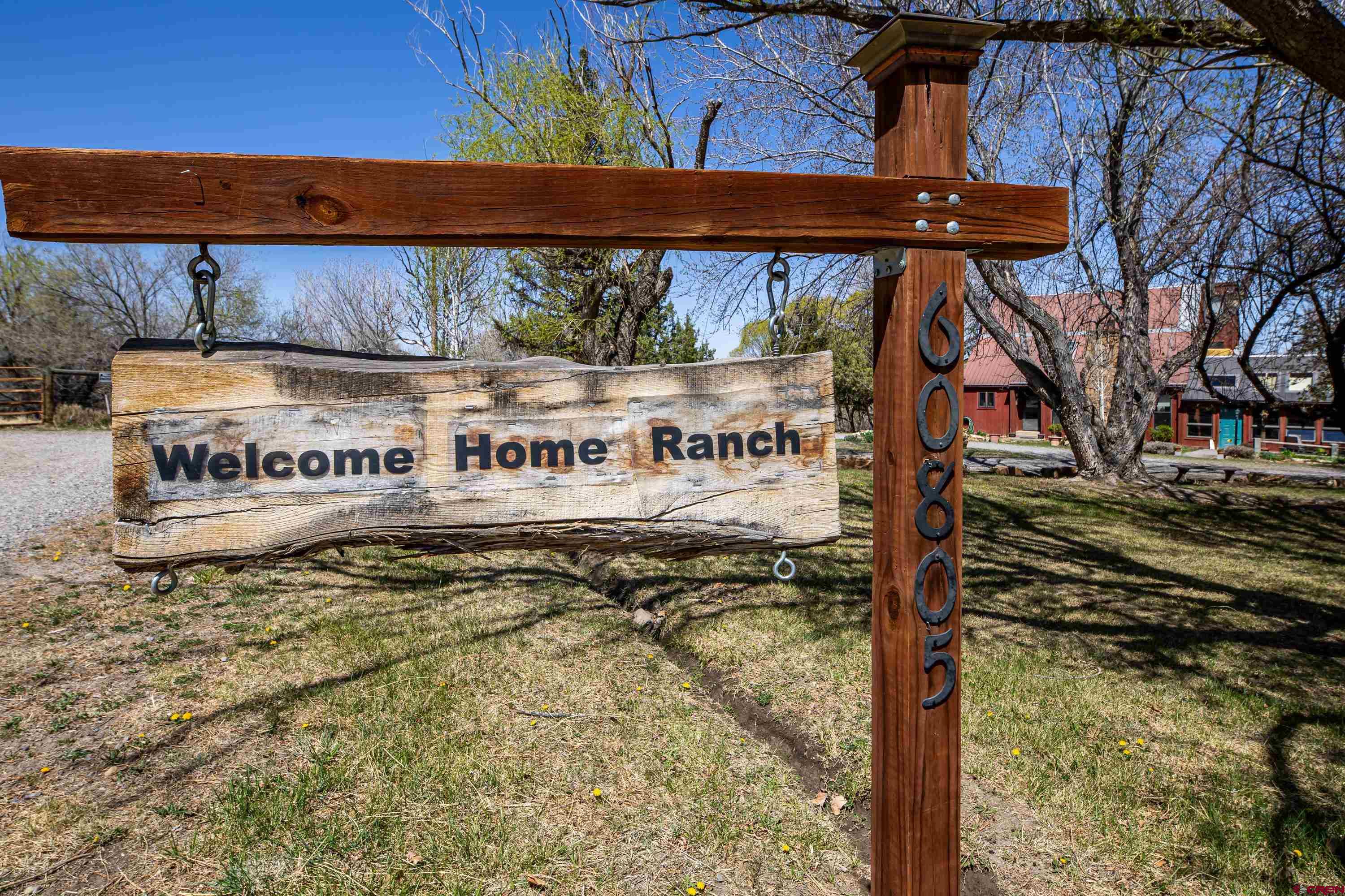 Imagine a horse property nestled on 5 irrigated acres of land, surrounded by lush greenery, garden spaces, scenic landscapes and even distant mountains on the horizon. Privacy here reigns supreme, with natural barriers like tall trees forming a cocoon of serenity around the estate. The location is prime—accessible yet tucked away. It’s close enough to conveniences like local shops, schools, and equestrian trails, but far enough to feel secluded. The property features pastures for grazing, sturdy fences, and even a charming 48x36 barn with spacious stalls, a tack room, wash bay, hay storage and kitchen/break room. There is a finished bonus room above the barn for overnight quests or a helper's bunk.  This also includes a BONUS regulation sized riding arena for training and practicing. At the heart of the property, there’s a charming 2 story home with 2 car attached garage classic architectural details, open concept, vaulted ceiling and a loft overlooking the family room with a lovely fireplace. Large mudroom to kick off your boots and a greenhouse/sunroom for all your herbs and flowers. A walkout 1 bedroom, 1 bathroom apartment below with a kitchen, dining area and living room. Adjacent to the main home is a tiny house with a modern twist, perfect for guests, a private retreat, or a creative workspace. This haven is designed to offer peace for both horse and human, where every sunrise over the fields feels like a gift. Does this vision match what you had in mind? Call for a showing, do not let this one get away!