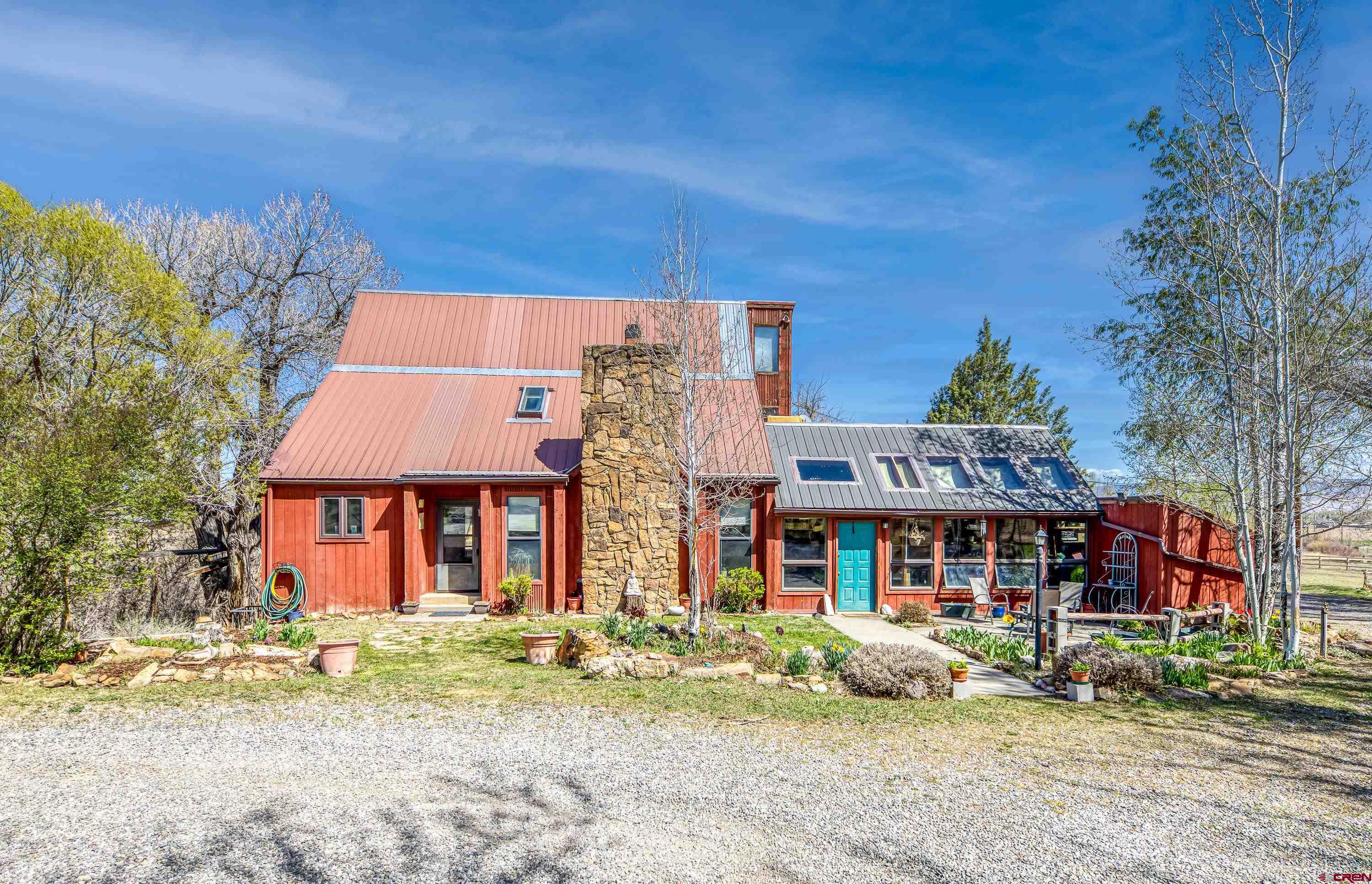 Imagine a horse property nestled on 5 irrigated acres of land, surrounded by lush greenery, garden spaces, scenic landscapes and even distant mountains on the horizon. Privacy here reigns supreme, with natural barriers like tall trees forming a cocoon of serenity around the estate. The location is prime—accessible yet tucked away. It’s close enough to conveniences like local shops, schools, and equestrian trails, but far enough to feel secluded. The property features pastures for grazing, sturdy fences, and even a charming 48x36 barn with spacious stalls, a tack room, wash bay, hay storage and kitchen/break room. There is a finished bonus room above the barn for overnight quests or a helper's bunk.  This also includes a BONUS regulation sized riding arena for training and practicing. At the heart of the property, there’s a charming 2 story home with 2 car attached garage classic architectural details, open concept, vaulted ceiling and a loft overlooking the family room with a lovely fireplace. Large mudroom to kick off your boots and a greenhouse/sunroom for all your herbs and flowers. A walkout 1 bedroom, 1 bathroom apartment below with a kitchen, dining area and living room. Adjacent to the main home is a tiny house with a modern twist, perfect for guests, a private retreat, or a creative workspace. This haven is designed to offer peace for both horse and human, where every sunrise over the fields feels like a gift. Does this vision match what you had in mind?  Call for a showing, do not let this one get away!