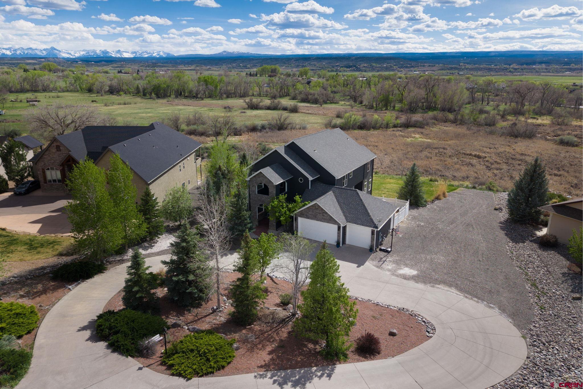 Positioned on a quiet cul-de-sac just south of Montrose, this 4,313 square foot residence offers a refined balance of privacy, scale, and proximity to everyday conveniences. Set on .77 of an acre, the property is oriented to capture unobstructed San Juan Mountain views, creating a composed and private backdrop.  The interior is defined by clean lines and intentional design. An open kitchen anchors the main level, complemented by two dining areas and distinct living spaces that provide both flow and separation. A finished walk-out basement extends the living experience, offering flexibility for entertaining or long-term guests.  Three en-suite bedrooms deliver a high level of comfort and privacy, while two dedicated office spaces support a modern, work-from-home lifestyle without compromise. Every element of the home is arranged to offer both function and quiet sophistication—designed for those who value space, privacy, and intentional living.  Opportunities like this are limited in this market. Schedule your private showing today before it’s no longer available.