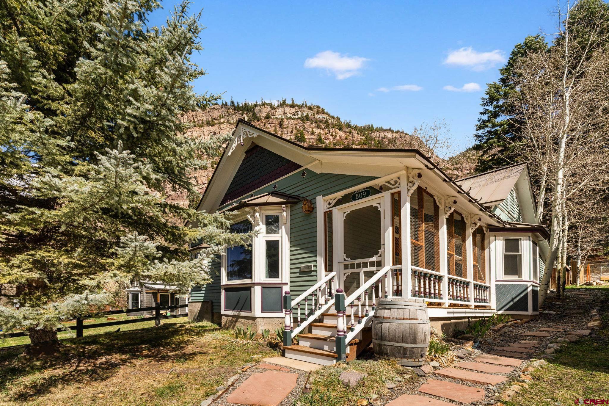 Nestled in the heart of the dramatic Ouray box canyon, this meticulously maintained 2-bedroom, 1-bath home offers a rare opportunity to experience the unmatched lifestyle in the Switzerland of America.  One block from Main Street and two blocks from the center of town, this Victorian beauty blends comfort and convenience with authentic mountain charm.  Whether as a full-time residence, mountain getaway, or investment opportunity, this property captures the essence of Ouray living: fantastic red rock views, outdoor adventures start at the front door, and summer evenings with fireside happy hours.