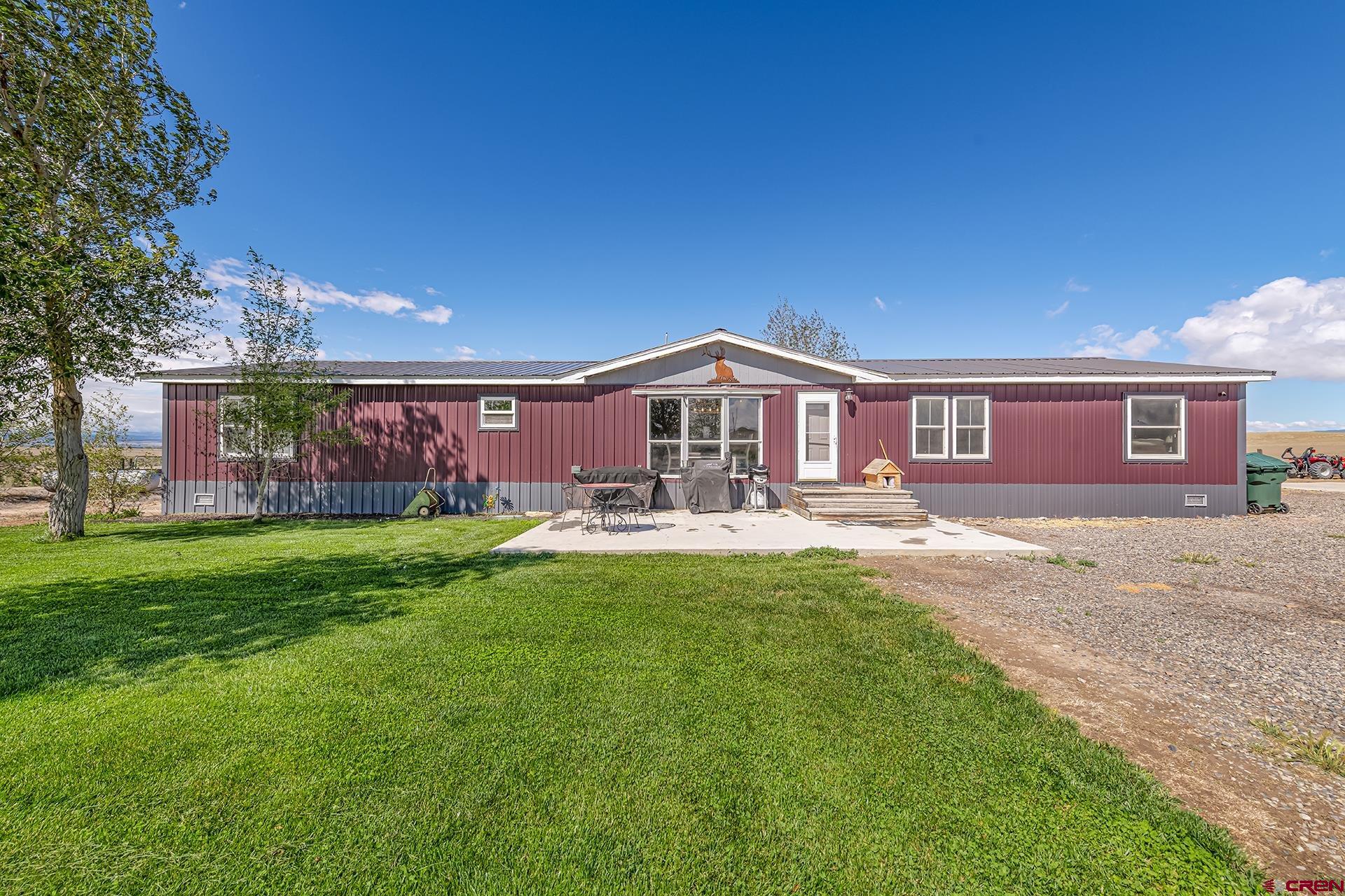 Versatile East Delta property with views, acreage, lovely home, and bonus shop! This mostly remodeled 2,128 sq. ft. home offers 3 bedrooms, 3 baths, brand new carpet, a split floor plan, and a new mini-split heating and cooling system. Enjoy low maintenance metal roofing and siding, a bright open kitchen with ample cabinet and counter space, and a sprinkler fed fenced yard. The property is partially set up for horses or livestock and includes a large heated/cooled shop with a bonus gym area. Adjoining over 1,300 acres of BLM land, you can recreate right from your backyard with endless opportunities for hiking, riding, hunting, horseback riding and exploring.