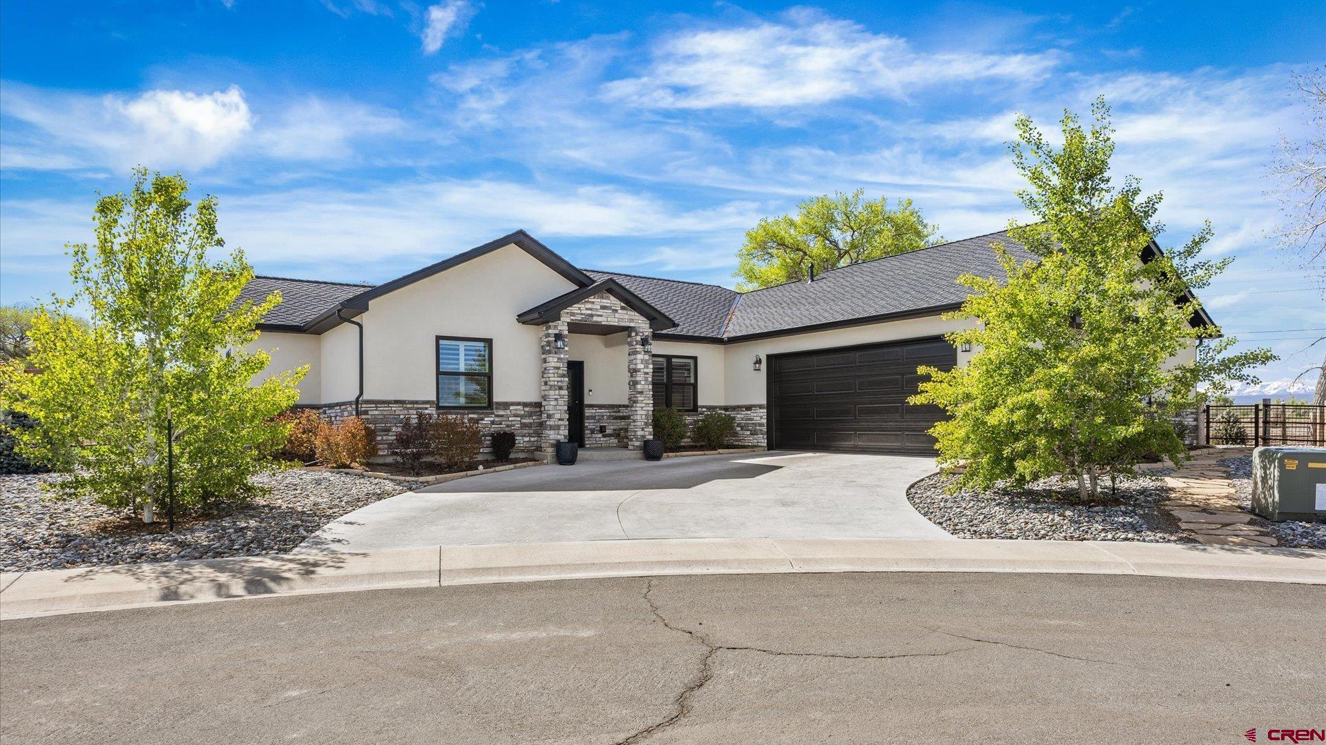 Located in the highly sought-after The Bridges community, this beautifully designed home offers the perfect blend of comfort, style, and convenience. Tucked away on a quiet cul-de-sac, the property showcases a spacious and inviting floor plan with quality finishes throughout. The open living area is filled with natural light and flows seamlessly into the kitchen and dining spaces, creating an ideal setting for entertaining or everyday living. The kitchen is thoughtfully designed with ample storage, generous prep space, and a functional layout for gathering, and is equipped with premium GE Café appliances, including a double electric convection oven and gas cooktop. The primary suite provides a relaxing retreat, complete with a well-appointed bathroom and walk-in closet. Additional bedrooms offer flexibility for guests, a home office, or hobbies. Designed with comfort and efficiency in mind, the home includes a four-quadrant radiant heating system, a Navien on-demand hot water system, and fiber internet wiring throughout. Every window is finished with Hunter Douglas plantation shutters featuring Auto Close functionality. Outdoor living is enhanced by a beautifully maintained, fully fenced and landscaped yard with Aspen and Blue Spruce trees, full sprinkler irrigation, and drip lines for all plantings. The exterior is accented with stone detailing on all four corners of the home. An oversized two-car garage provides abundant storage space. Conveniently located near golf, dining, shopping, and recreation, this home offers easy access to everything Montrose has to offer while enjoying the lifestyle and beauty of The Bridges community.