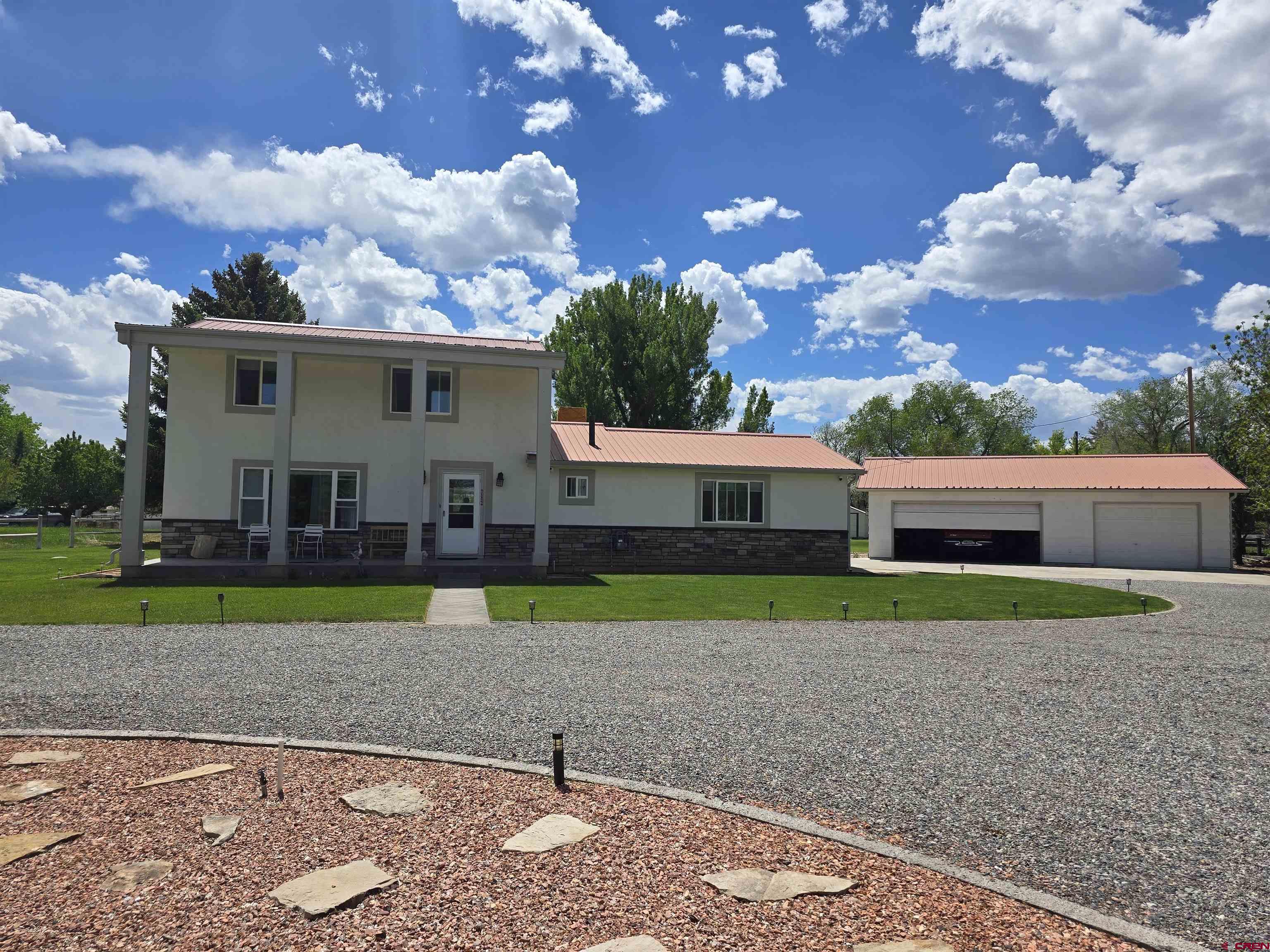 2 Story country home on .998 of an acre.  Property is landscaped and has mature fruit trees. Property has a 3 car detached garage, shed, irrigation, and sprinkler system. Patio is off the dining room to enjoy the evenings seating and relaxing.  There is a small guest house next to the main home.  Close to town