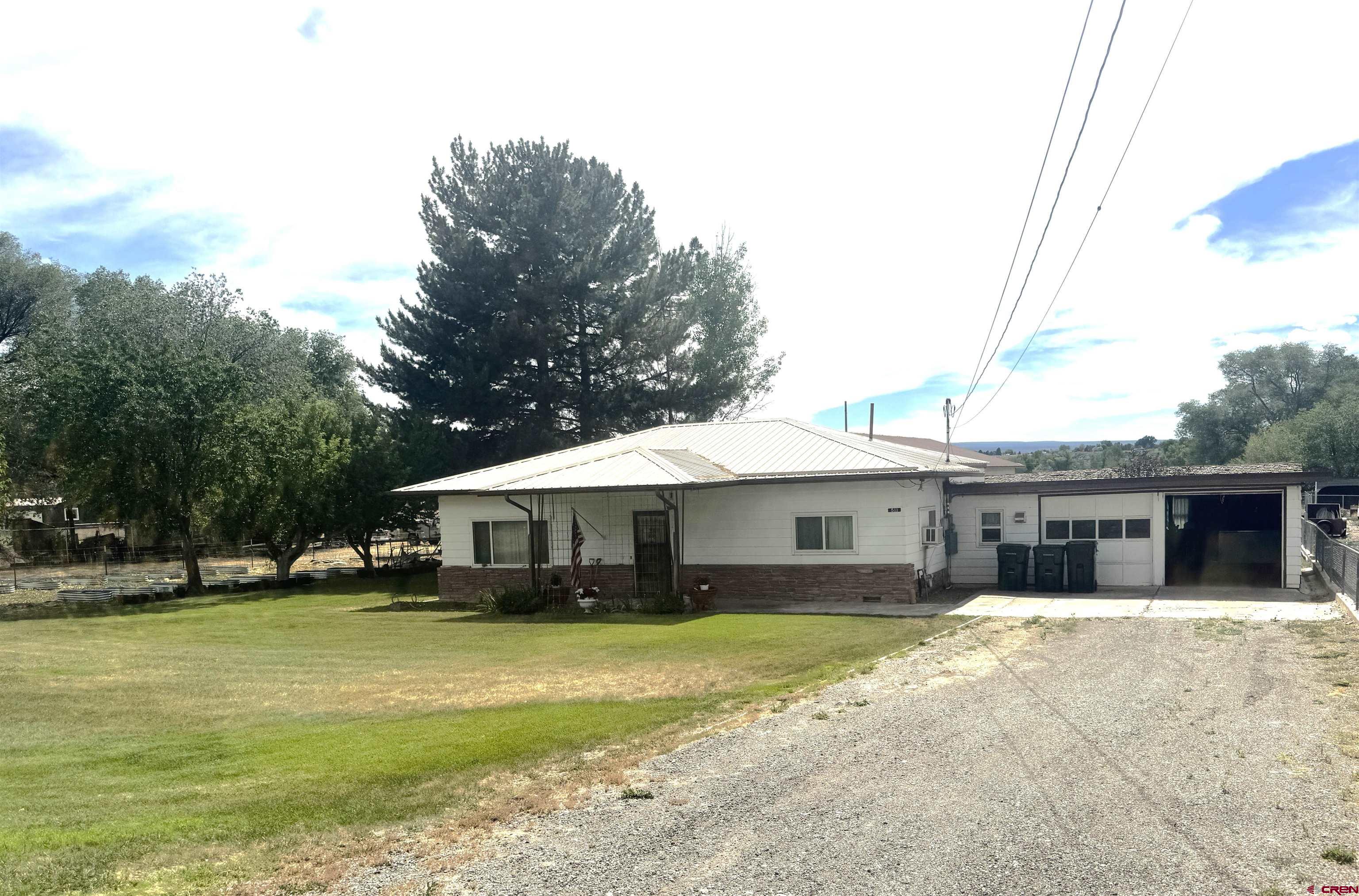 Unique property, many possible uses.  small older home with 2 bedrooms, one bath, bunkhouse also has 2 bedrooms one bath. larger 2400 sq ft  shop built in 1995  bunk house built in 1988  additional photos to follow