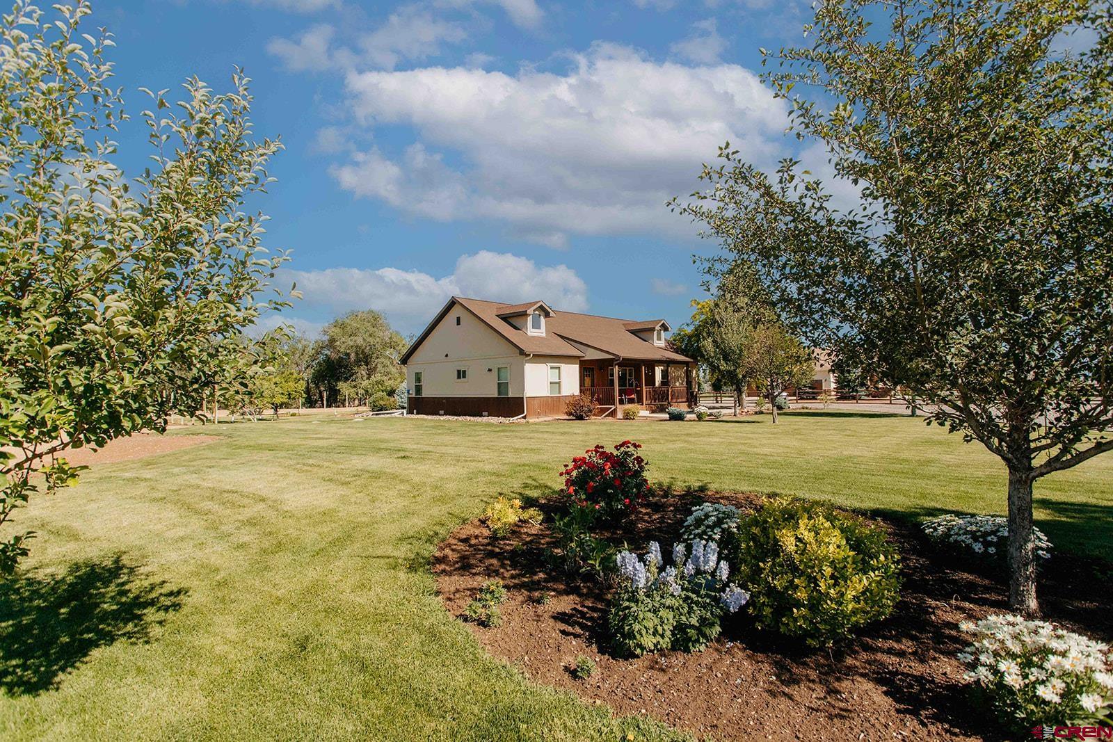 First Time on the Market! Experience the county lifestyle in this beautifully maintained 3 bedroom 2 bath ranch style home with an oversixed 2 car garage on 2 acres.  Start your mornings on the East facing front porch or enjoy the warmth of the living room real woodstove.  This move in ready split-floor plan home has white oak flooring with bedroom carpet and tile bathrooms.  Stainless steel appliances in the kitchen with with tall knotty alder cabinets and granite slab countertops. Ceiling fans and 9' ceilings throughout home.  Plenty of room on this 2 acre property for your shop or barn, horses or 4H animals or your R/V.  Enjoy the harvest from your 9 producing fruit trees: apple, peach & cherry.  Forced air, natural gas heat, central A/C, irrigation water via the HOA.  Come live the country life in Spring Creek Meadows with no neighbors behind you!