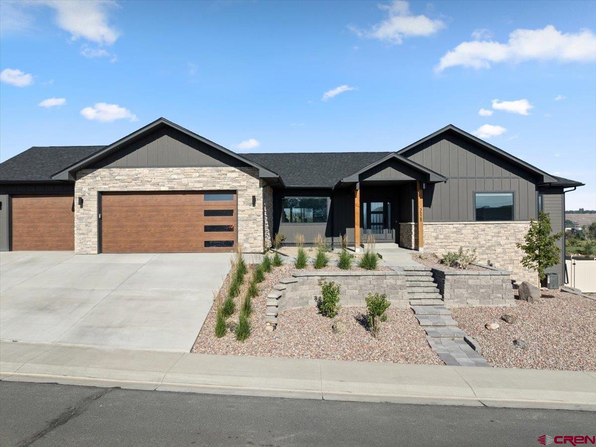 Modern luxury meets high-tech comfort at 3528 Ridgeline Drive, located in the desirable Estates at Stone Ridge subdivision. Built in 2025, this immaculate 3,673 sq ft, 4-bedroom, 3-bathroom stick-built home offers an unparalleled blend of spacious living and cutting-edge technology. Step into a fully integrated smart home designed for ultimate convenience. Driveway shoveling is a thing of the past with premium radiant heat installed in both the driveway and the massive 3-car attached garage. Inside, you will find a bright and spacious open concept layout, perfectly complemented by an additional living room that offers great versatility for hosting, a play area, or a quiet retreat. Don't miss this tech-forward dream home—schedule your showing today!