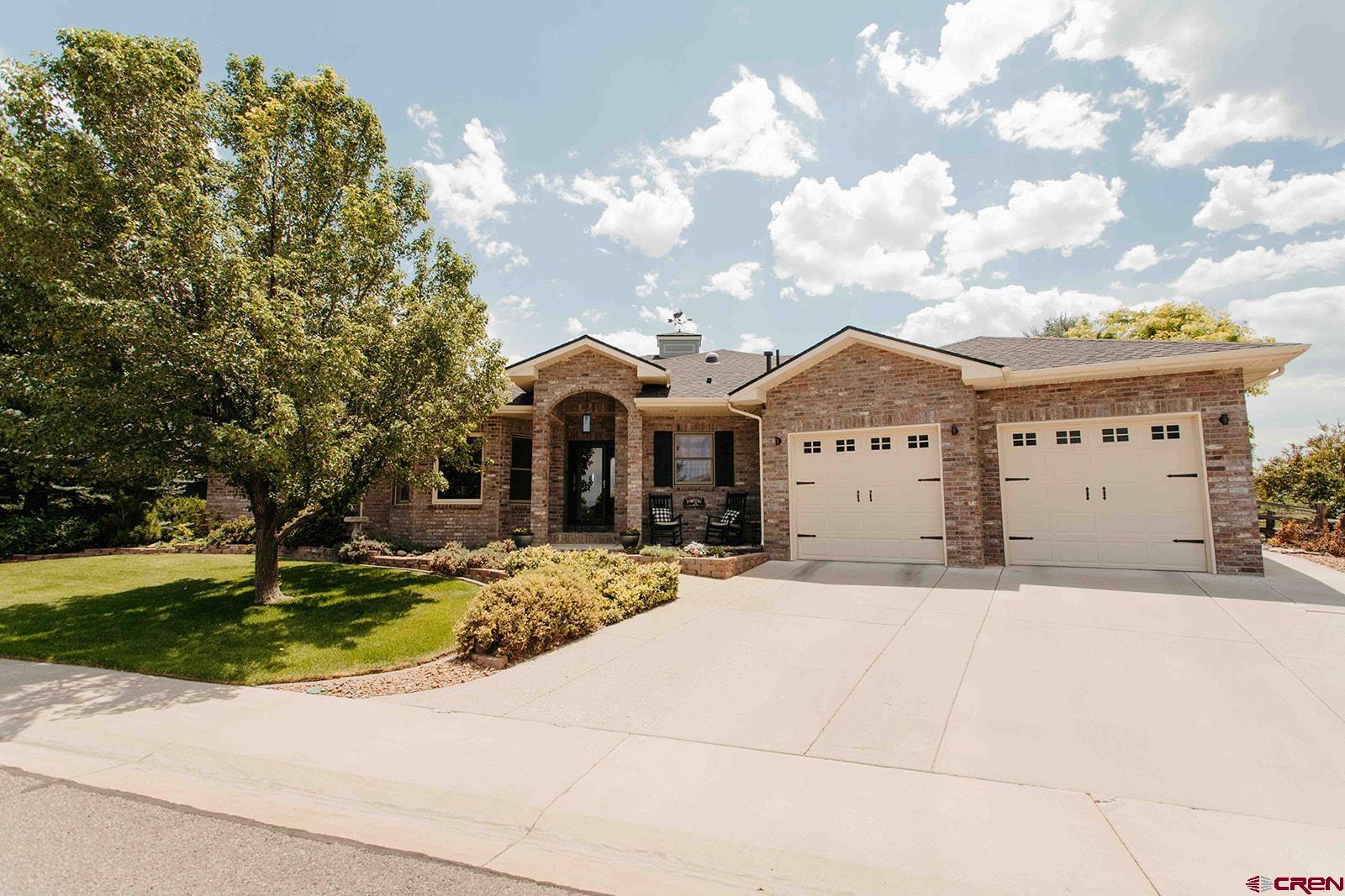 Welcome home to this beautifully updated ranch-style retreat in the highly sought-after Cobble Creek Golf Community! Offering 2,419 square feet of thoughtfully designed living space, this warm and inviting home features 3 bedrooms, 3 bathrooms, a dedicated office, and a spacious bonus/flex room that's perfect as a game room, media room, hobby space, or second living area.  From the moment you walk through the front door, you'll appreciate the spacious layout, generously sized rooms, and the comfortable feeling that instantly makes you feel at home. The living room is the heart of the home, centered around a cozy gas fireplace and flowing seamlessly into the kitchen and dining areas, making it ideal for both everyday living and entertaining.  The beautifully remodeled kitchen is sure to impress with quartz countertops, a designer tile backsplash, stainless steel sink, Bosch dishwasher, gas cooktop, double ovens, and under-cabinet lighting. Multiple dining spaces provide room for everything from casual breakfasts to holiday gatherings.  The primary suite is a peaceful retreat featuring a spa-inspired bath with a luxurious rain shower, custom wall safe, and a spacious walk-in closet. Sun tunnels throughout the home fill the kitchen, laundry room, guest bath, and primary closet with soft natural light.  Step outside and discover one of this home's most exceptional features. While backing to the Cobble Creek Golf Course, the property enjoys a generous open-space buffer between the course and the backyard, creating an uncommon level of privacy. Mature landscaping and fencing provide a secluded setting where you can unwind in the saltwater hot tub, gather around the gas fire pit on the flagstone patio, or host family and friends with plenty of space for your barbecue and outdoor dining. It's the perfect place to enjoy peaceful Colorado evenings.  Additional recent upgrades include a new roof (2024), fresh interior and exterior paint, updated window blinds, smart thermostat, smart irrigation system, Ring doorbell, upgraded interior and exterior lighting, and a custom built-in cabinet and table in the flex room.  Located on a beautifully landscaped quarter-acre lot with mountain views, central air conditioning, hardwood and tile flooring, an oversized two-car garage, and RV parking, this exceptional home offers the perfect combination of luxury, comfort, privacy, and functionality. Every space has been thoughtfully designed to create a home that is as welcoming as it is beautiful.