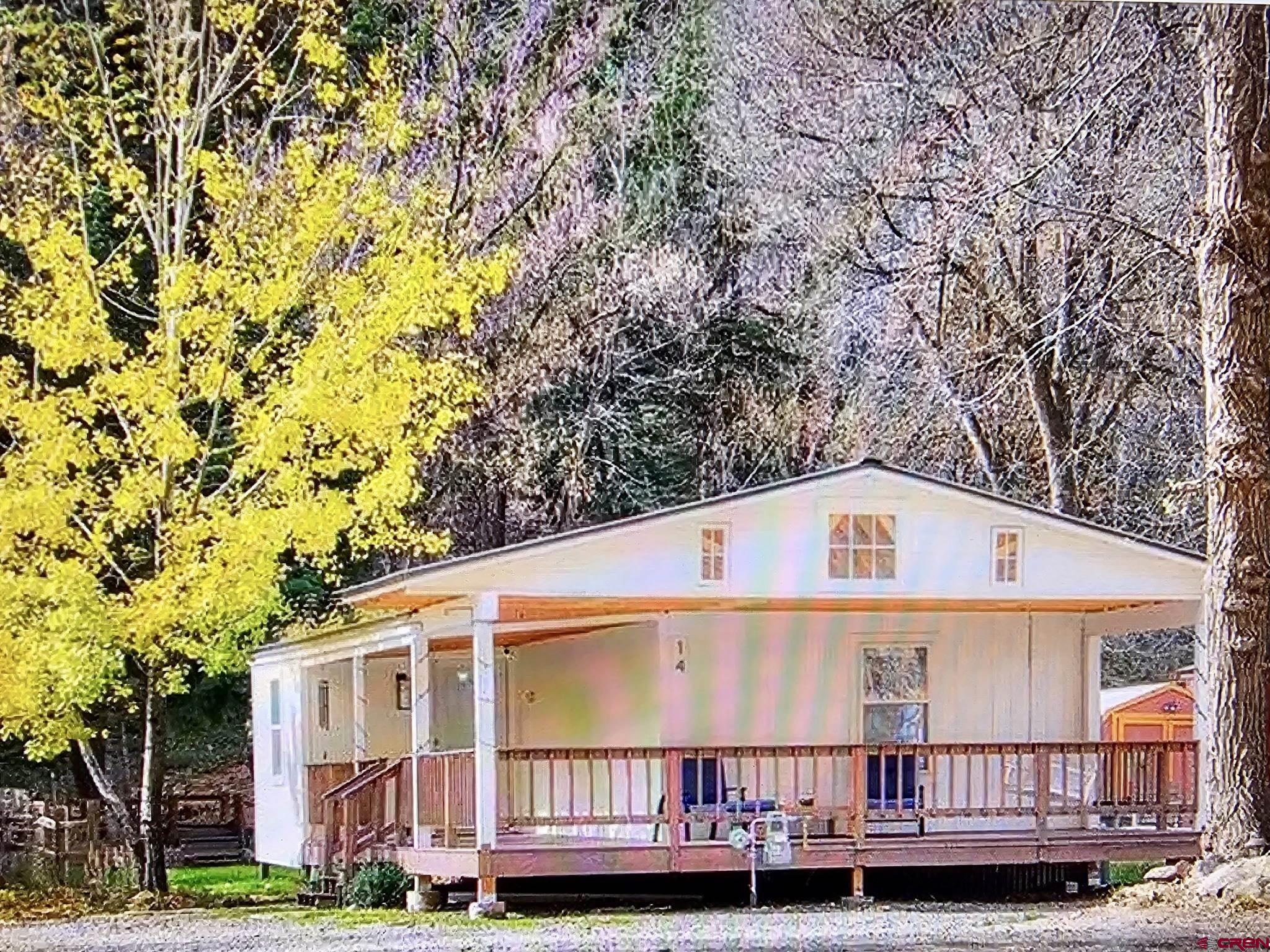 Affordable Elegance in the City of Ouray! This beautifully remodeled manufactured home is ideally located just one mile from downtown Ouray. Enjoy unobstructed river views right across the street, all while being surrounded by the stunning San Juan Mountains. Outdoor recreation is right at your doorstep, with hiking trails just a short walk away in the summer and a two-mile riverside walking and cross-country ski trail just outside the door. Inside, beautiful new flooring, remodeled bathrooms, an updated laundry room, and refreshed living areas create a modern, upscale feel throughout. There is plenty of parking with room for 3+ vehicles. The peaceful setting and scenic surroundings make this a wonderful place to look forward to coming home to. Call today to schedule your showing!
