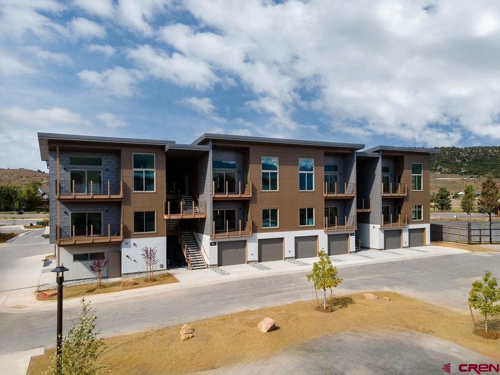 5 total units left to sell, closing out Ridgway Riverfront in the next two months. Don't miss this opportunity. Third-floor penthouse unit with vaulted ceilings. The last top-floor two-bedroom. This unit has huge direct Box Canyon views into Ouray, a two-plus car garage, air conditioning, south south-facing deck, and only one shared wall. Perfectly situated as the only Ridgway residential project on the Uncompahgre River, Riverfront Village offers quick highway access to Telluride, Ouray, Silverton, and Montrose while a stroll down the river trail leads to downtown shops and restaurants.