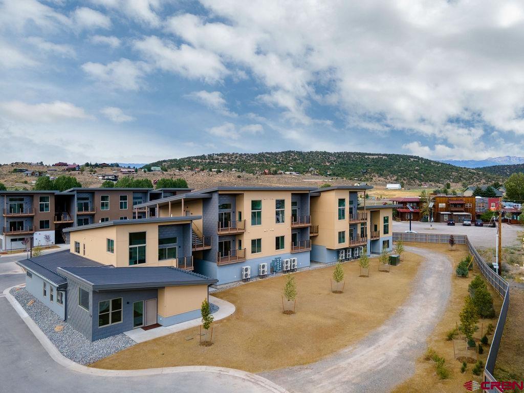 Lock and Leave. 5 total units left to sell, closing out Ridgway Riverfront in the next two months. Don't miss this opportunity. Second-floor penthouse unit with vaulted ceilings. A two-plus car garage, air conditioning, south-facing deck, and NO shared walls. Perfectly situated as the only Ridgway residential project on the Uncompahgre River, Riverfront Village offers quick highway access to Telluride, Ouray, Silverton, and Montrose while a stroll down the river trail leads to downtown shops and restaurants.