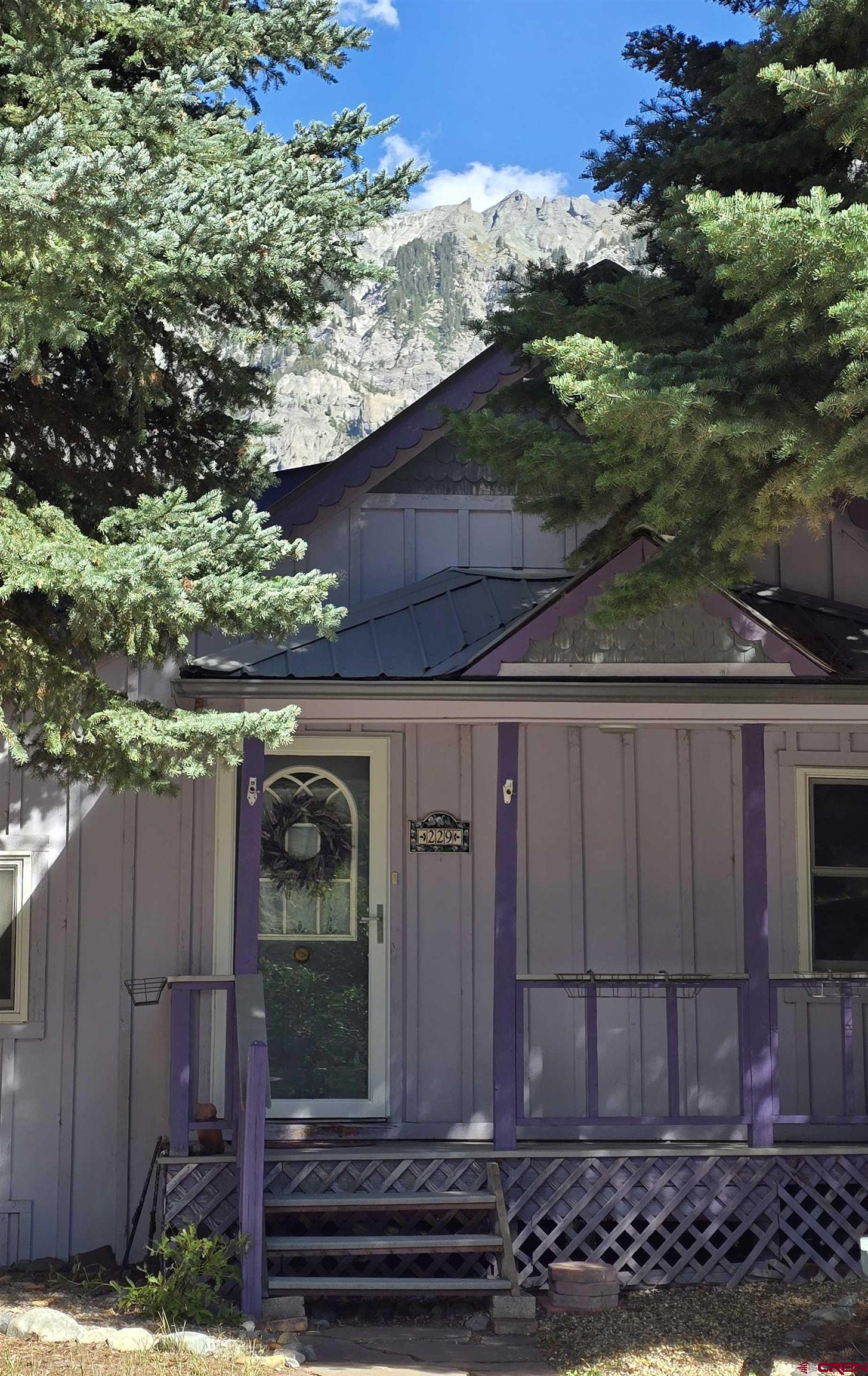 Affordable Ouray opportunity! This 2-bed, 1-bath home is walking distance to everything in town, with a lovely backyard and views of the Amphitheater and Twin Peaks.  Recent updates include new flooring (2022), new windows with a transferable warranty (2023), new blinds (2023), and quality new appliances (2023). The forced-air ducts were professionally cleaned in 2025. A metal roof tops the house, and a high-end wood stove keeps it cozy through the winter. Two storage sheds are included.  The zoning allows multi-family use and short-term vacation rentals, so it works as a full-time home, second home, or income property. Schedule your showing today.