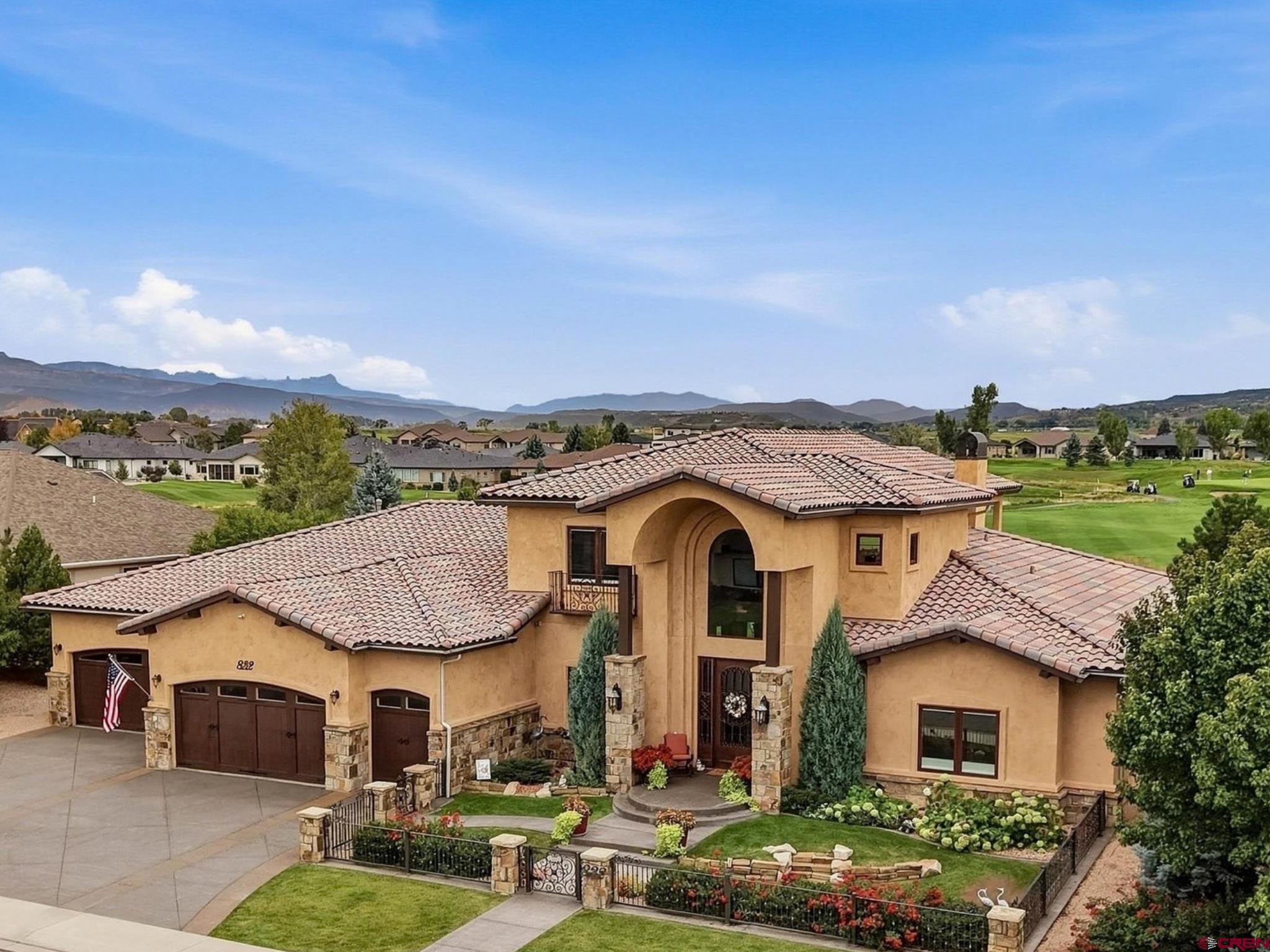 Show-Stopping, Search-Ending, Golf Course Masterpiece Estate with Majestic Mountain and Riparian Views, Unmatched Quality and Finishes, and Unparalleled Amenities and Lifestyle! Delivering multiple en-suites, a massive 4+ car, extra-deep garage, the gourmet, chef's kitchen of your dreams, and a bonus, full outdoor chef's kitchen and guest kitchenette, meticulous attention to detail and integritous construction, and quite literally the best home to throw parties and give your loved ones the time of their life; this home truly has it all. A towering, elegant entryway with authentic travertine tile, a spiral staircase, and a soaring, vaulted ceiling with transom windows ushers you into a classic yet modern, open floor plan. Find strategic touches and timeless features throughout, such as absolute view capitalization, en-suites on both floors, and knotty alder woodwork and built-ins. One step into the kitchen and you're home; from stunning quartzite countertops to glorious Wolf/Sub-Zero appliances including 2 ovens, an additional steam oven, a 48" 6-burner Range Top and Hood, a 2-door expanded fridge, ice maker, a huge island with an additional sink, floor-to-ceiling custom cabinetry, a walk-in pantry that is an experience in itself, all finished with an ergonomic layout and magical charisma just waiting to be your platform for creating memories tangible and tasteful. The living and dining spaces feature high-character hardwood floors and continued stone tile, a mesmerizing stone fireplace, and gallery-style windows to captivate your imagination as you and your guests gaze upon lush golf course acreage framed by ponds, creeks, and ultimately the enchanting outline of the San Juan and Cimarron mountain ranges. Relax and pamper yourself with style and comfort every day in your own, spa-style main en-suite with an oversized, microsilk soaking tub, beautiful tiled walk-in shower, and a walk-in 'closet' with unbelievable customization, with its own island, a bench, and drawers galore, and all the accommodations for every last little thing you're bringing with you. Don't compromise for your guests with an additional main floor en-suite, complete with a private kitchenette, gorgeous views, a walk-in closet to rival most others, and consistency in finishes with quartzite, hardwood floors and quality tile and knotty alder woodwork. Also on the main floor is a superb office, adorned with hardwood floors and knotty alder built-ins, as well as a spacious and extended laundry room, perfect for keeping the mess out of sight and complete with tons of counter space and cabinetry, a sink, and great natural light to keep the mundane tasks of life feeling elevated. Upstairs is a fantastic entertaining space with an additional kitchen, pool table, extra bedroom with a Murphy bed, plenty of room to spread out and watch the game, and a walk-out deck to enjoy enhanced views. Think a luxury golf course home is going to cut corners on garage size, function, and tinkering potential? Think again with the full-epoxied, extra-deep, 4+ car garage with a golf cart stall, large closet, and an unbelievable amount of room for extra vehicles, projects, and toys. Step outside and your favorite beverage will hit differently as you watch golfers meander down the fairway and watch the seasons change from what is an absolutely next-level backyard oasis. Featuring a full outdoor kitchen, water feature, hot tub, extended stamped concrete with multiple seating and dining areas, and endless views, you will enjoy all seasons with this spectacular, south-facing backyard paradise. Owning the prestige of a curated, fully custom-built Sullivan construction home, further upgrades include a coveted geothermal heat and cooling system, triple-pane Pella windows throughout, and peace of mind knowing this home was constructed with care and concern. The