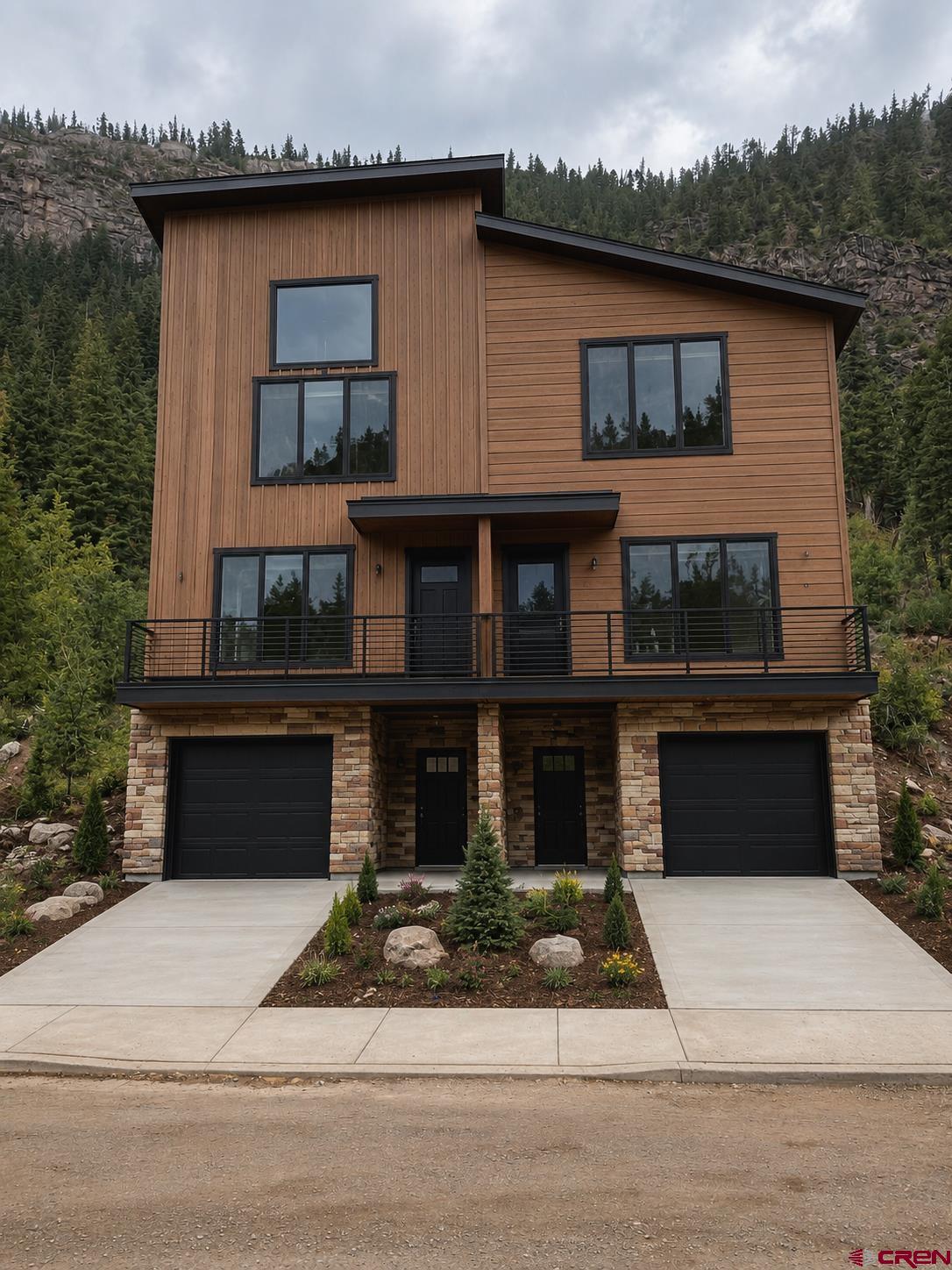 This beautifully appointed 2-bedroom, 2½-bath townhome features expansive windows that frame breathtaking mountain views and fill the home with natural light. The open-concept design blends contemporary finishes with warm mountain charm. Enjoy the convenience of a one-car garage and a private backyard that borders National Forest, offering exceptional privacy and direct access to the outdoors. Just minutes from downtown Ouray’s shops, restaurants, hot springs, and endless recreation, this home is the perfect full-time residence, mountain getaway, or investment opportunity (zoned R2).