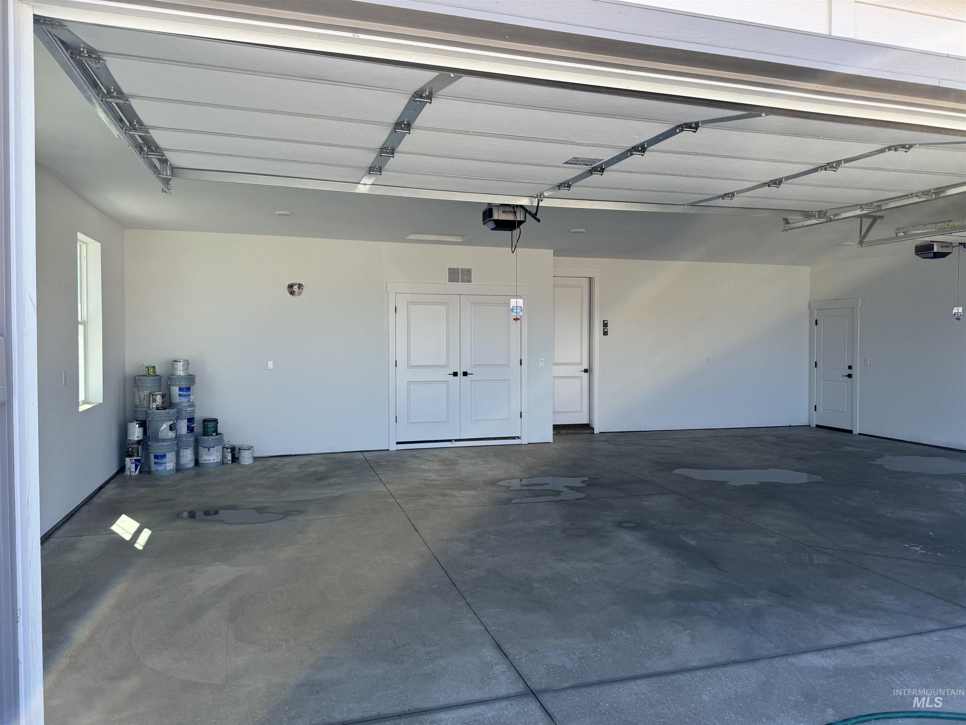 Garage featuring a garage door opener