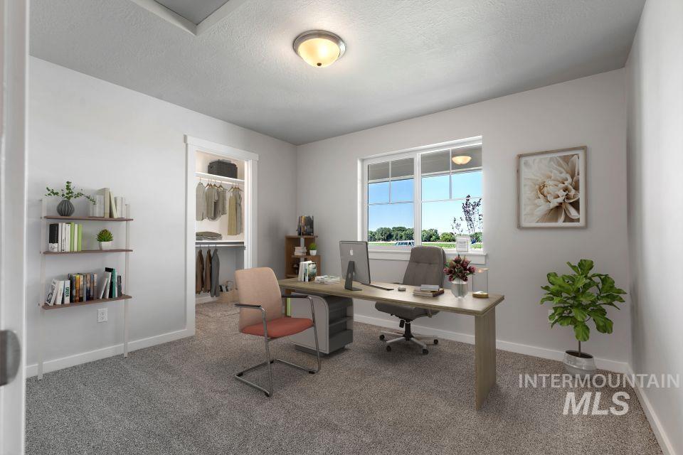 Office featuring carpet and a textured ceiling