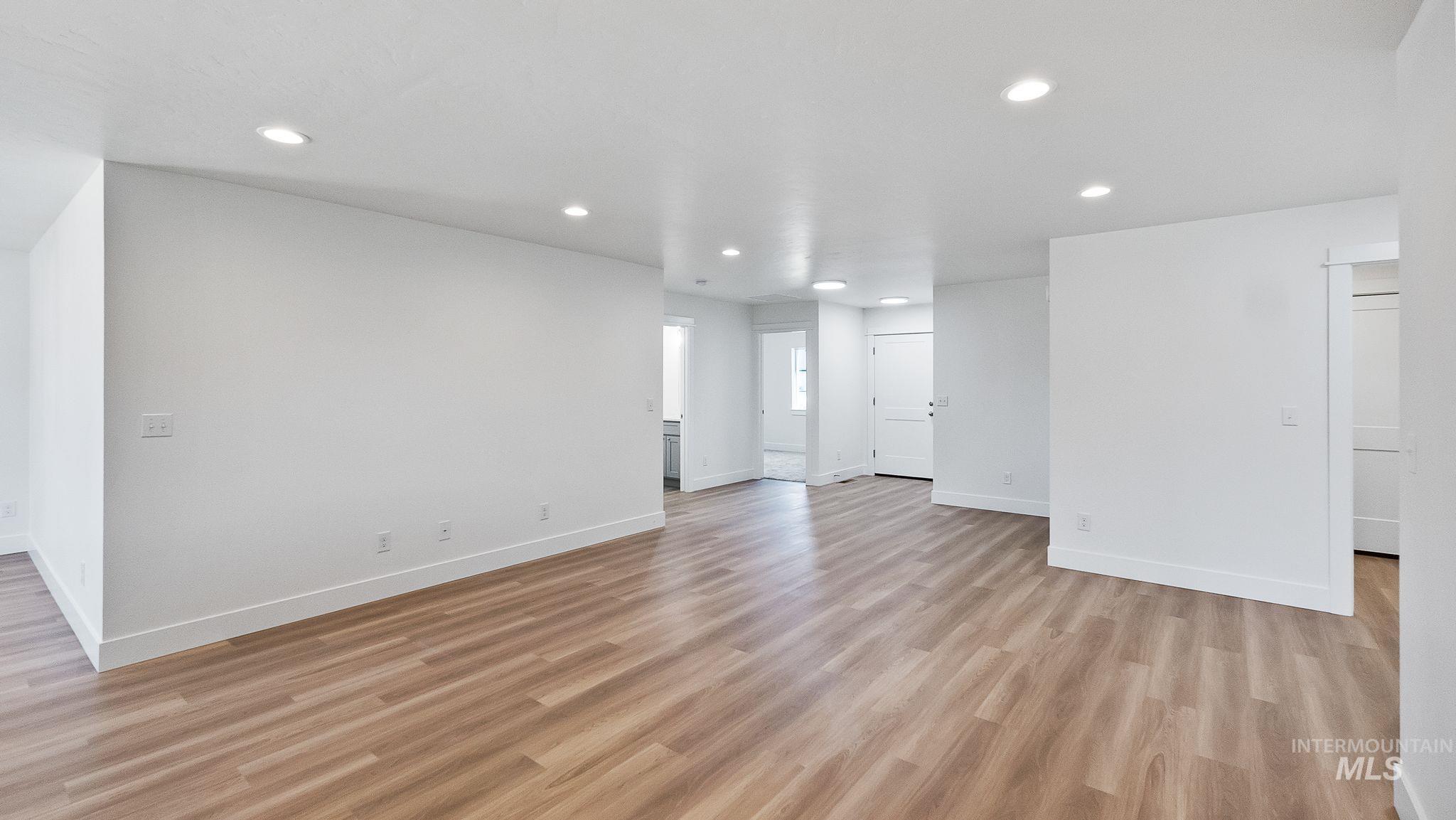 Unfurnished living room featuring recessed lighting and light wood-style floors