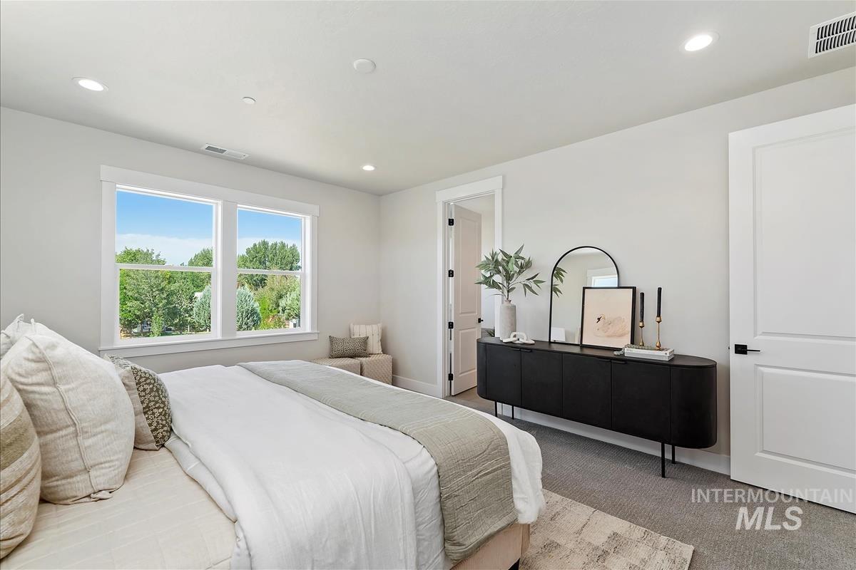 Bedroom with carpet flooring and recessed lighting