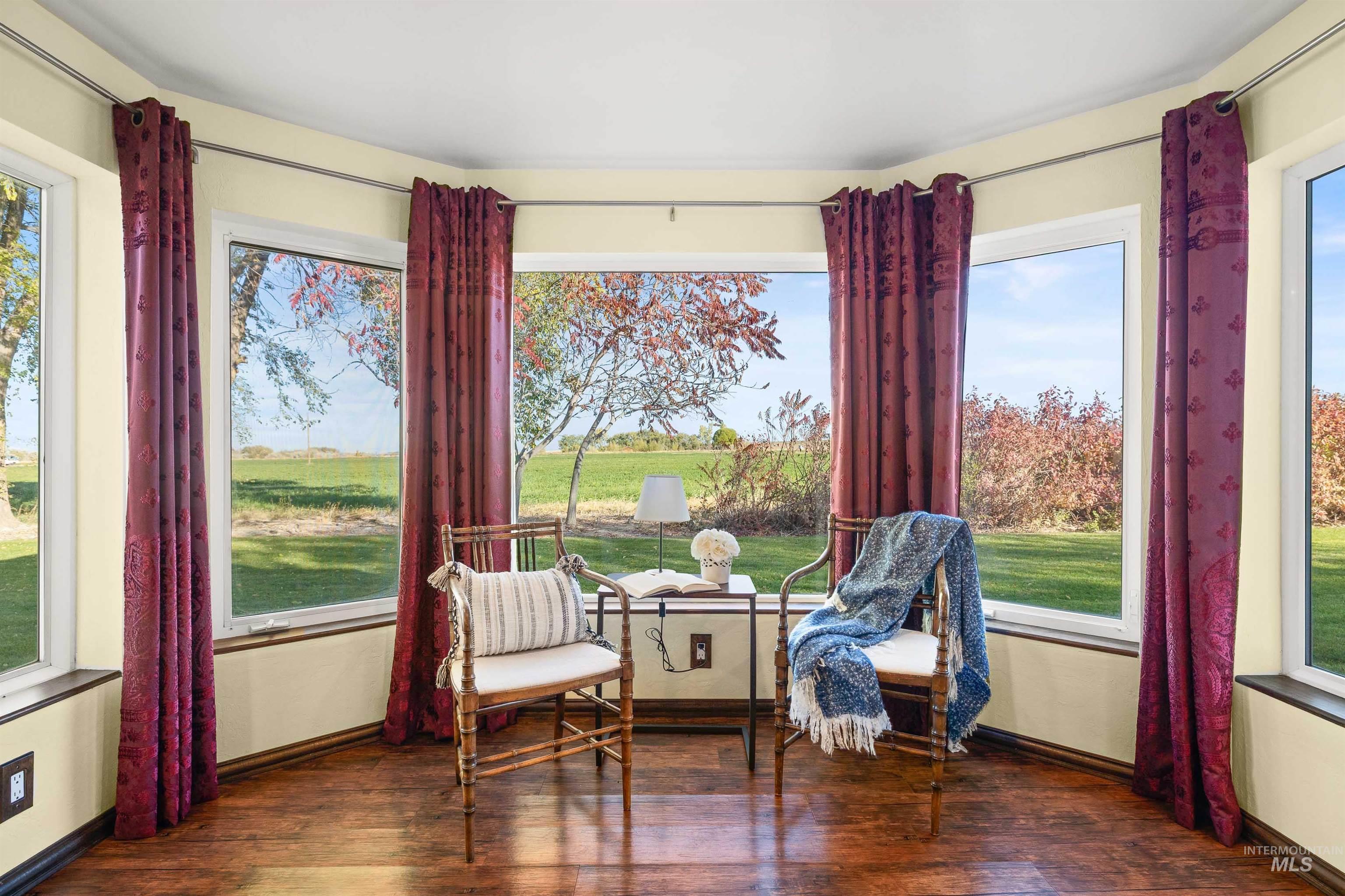 Living area with dark wood-style flooring