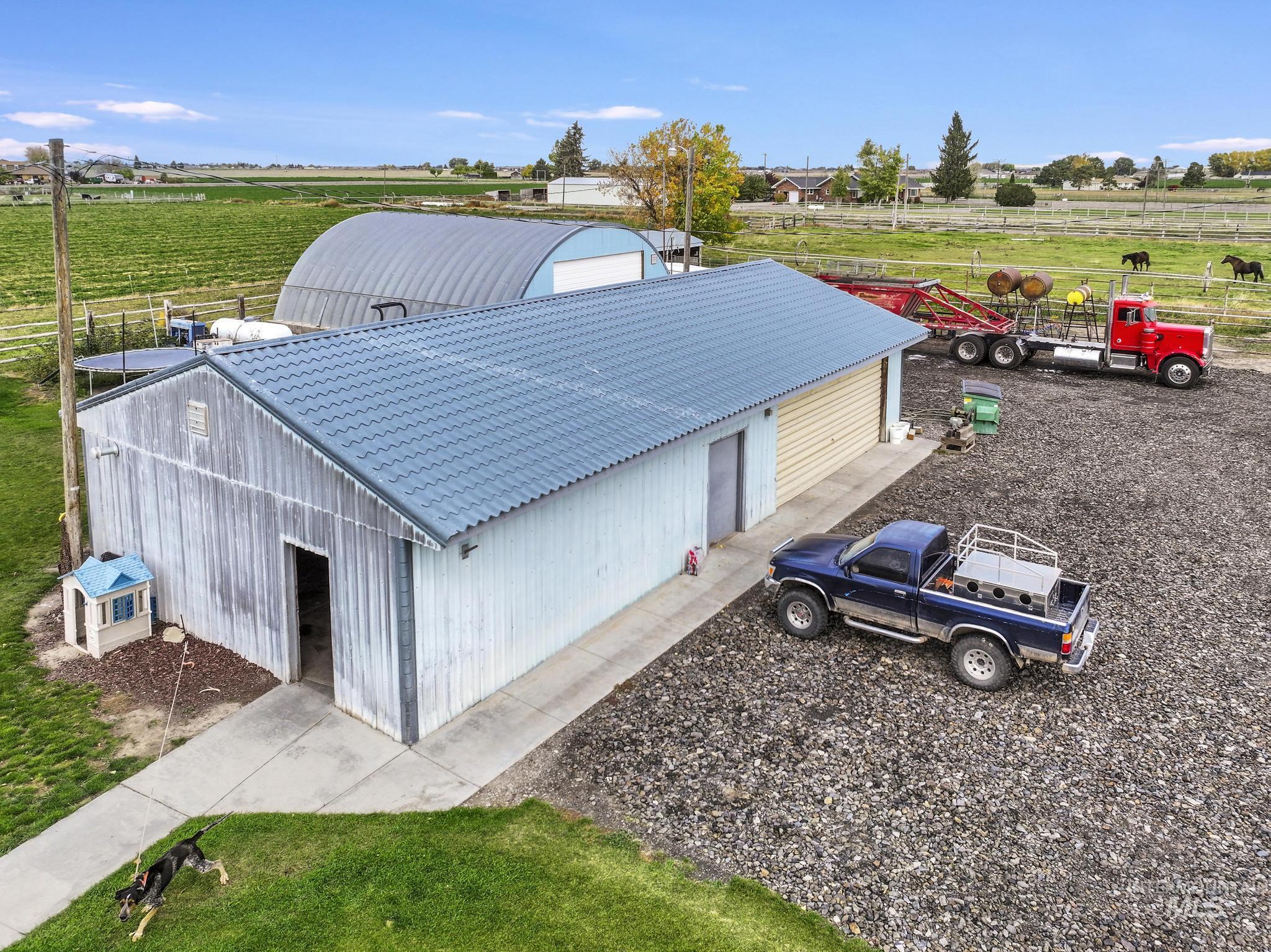 View of outbuilding with a rural view and agricultural area